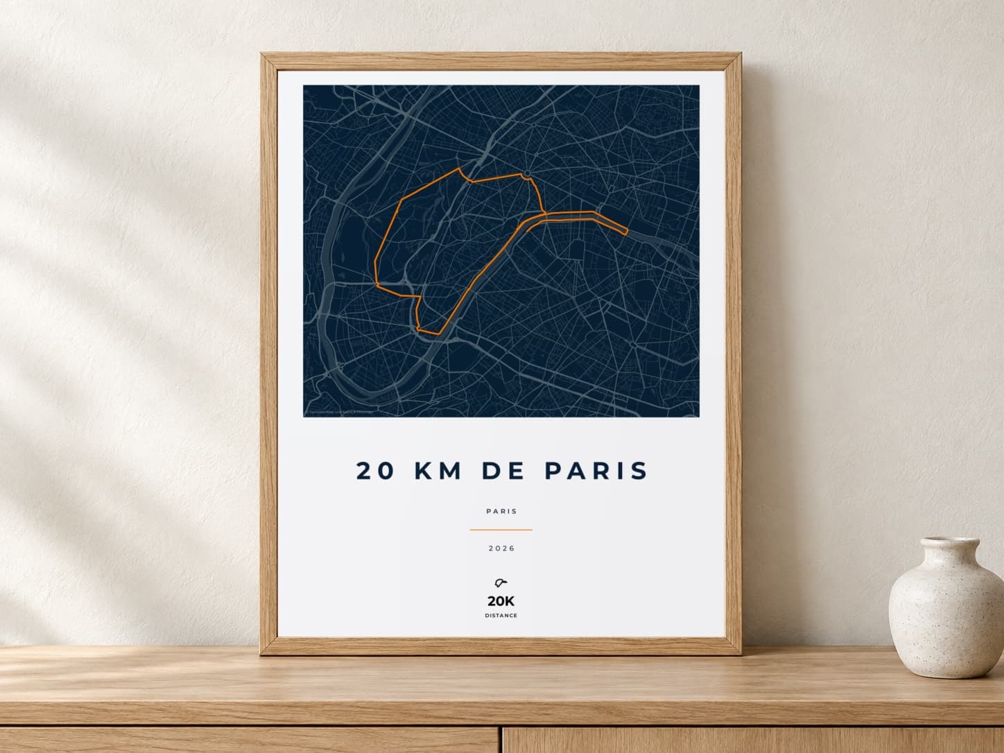 20 km de Paris 2026 Race Blueprint route print in a light oak frame on a console