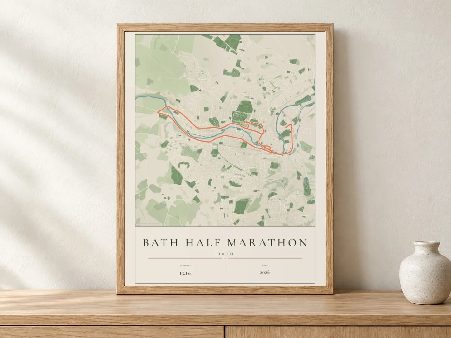Bath Half Marathon 2026 Parkland route print in a light oak frame on a console