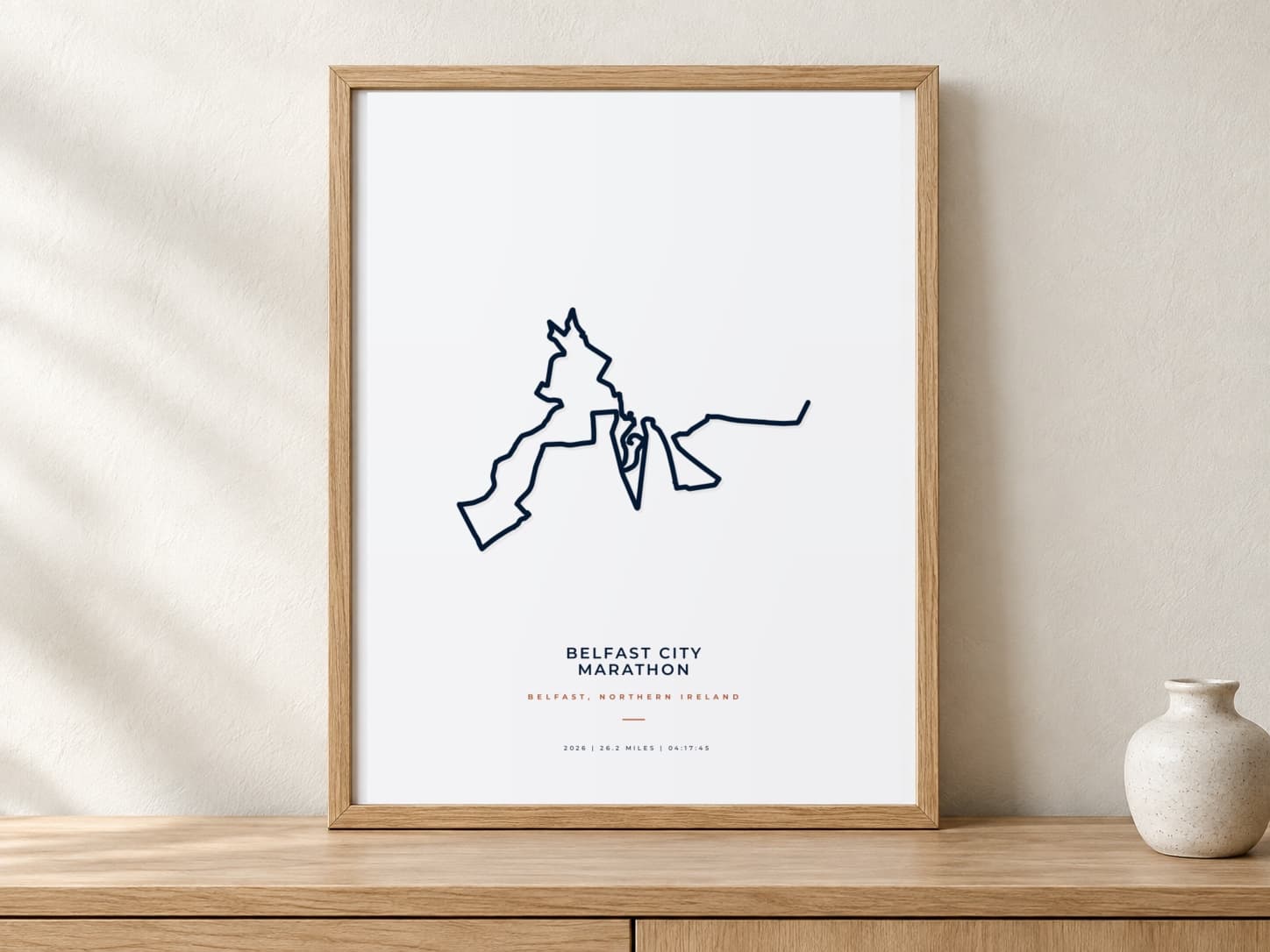 Belfast City Marathon 2026 Minimal route print in a warm framed display scene