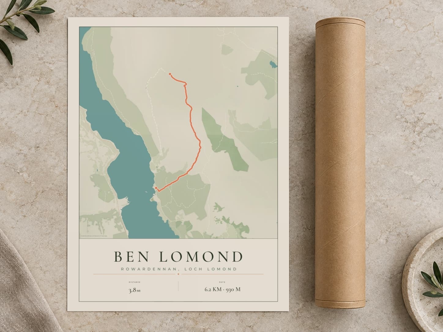 Cardboard postal tube beside a flat Ben Lomond route print
