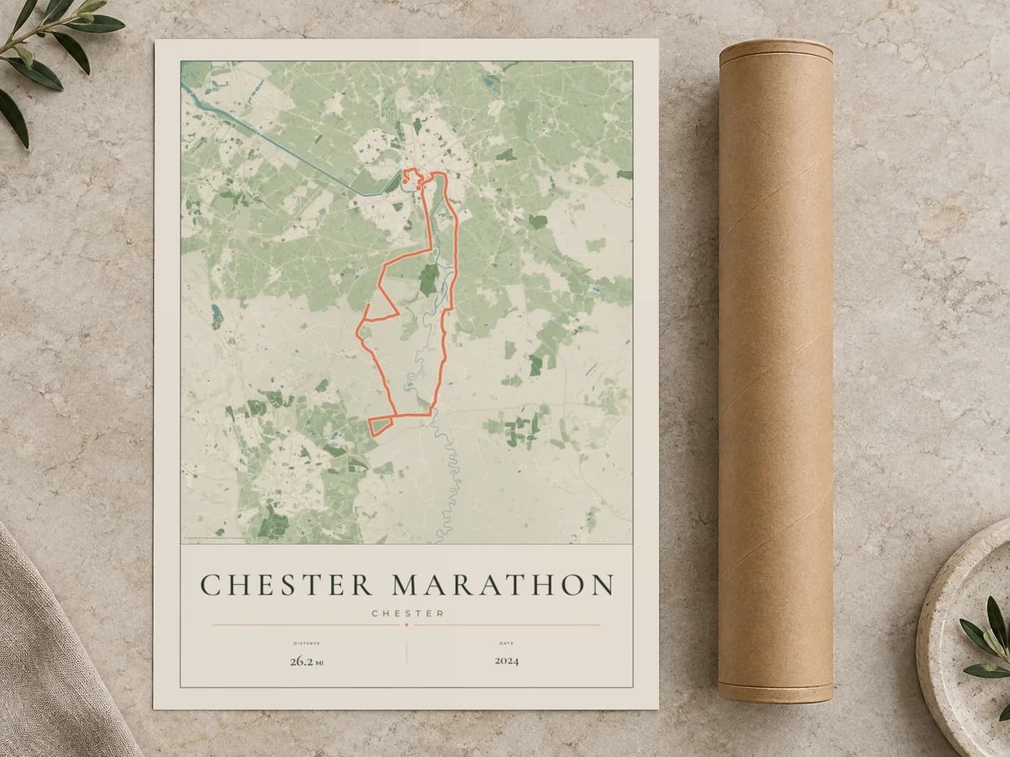 Cardboard postal tube beside a flat Chester Marathon route print