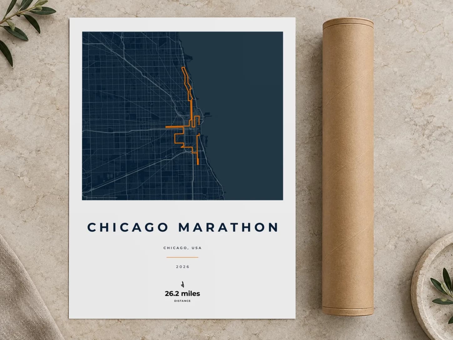 Cardboard postal tube beside a flat Chicago Marathon route print
