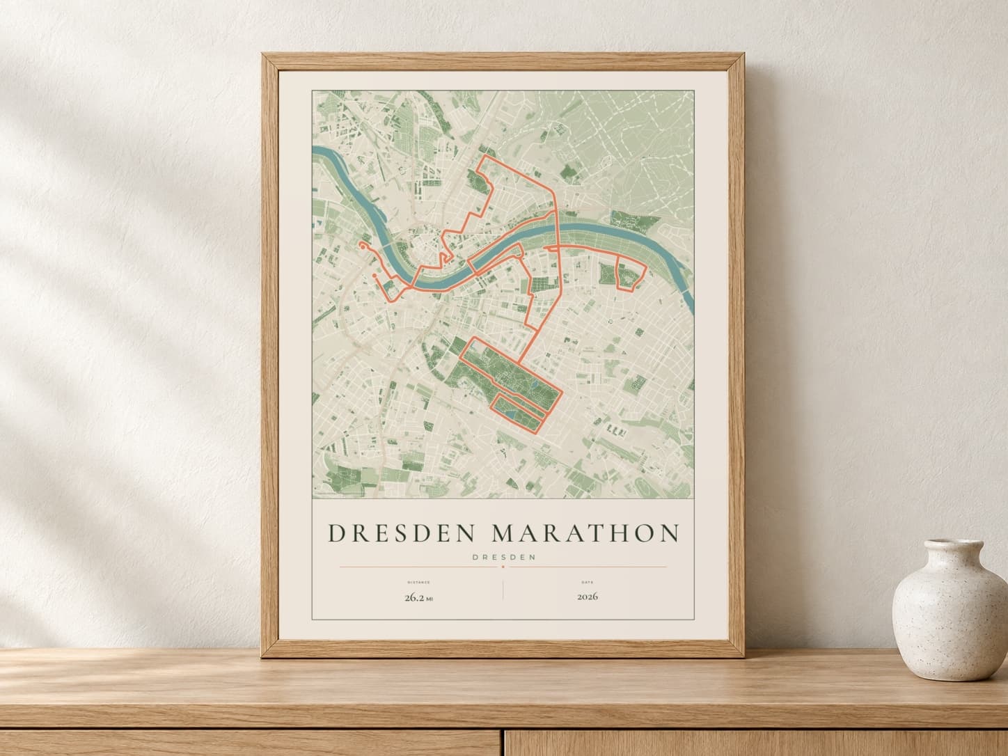 Dresden Marathon 2026 Parkland route print in a light oak frame on a console