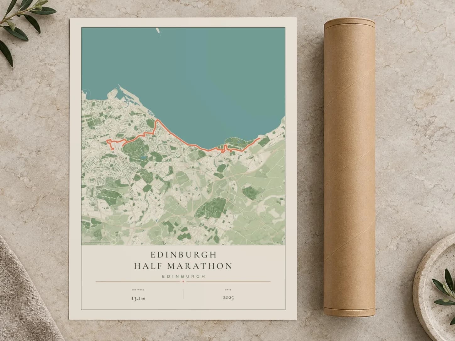 Cardboard postal tube beside a flat Edinburgh Half Marathon route print