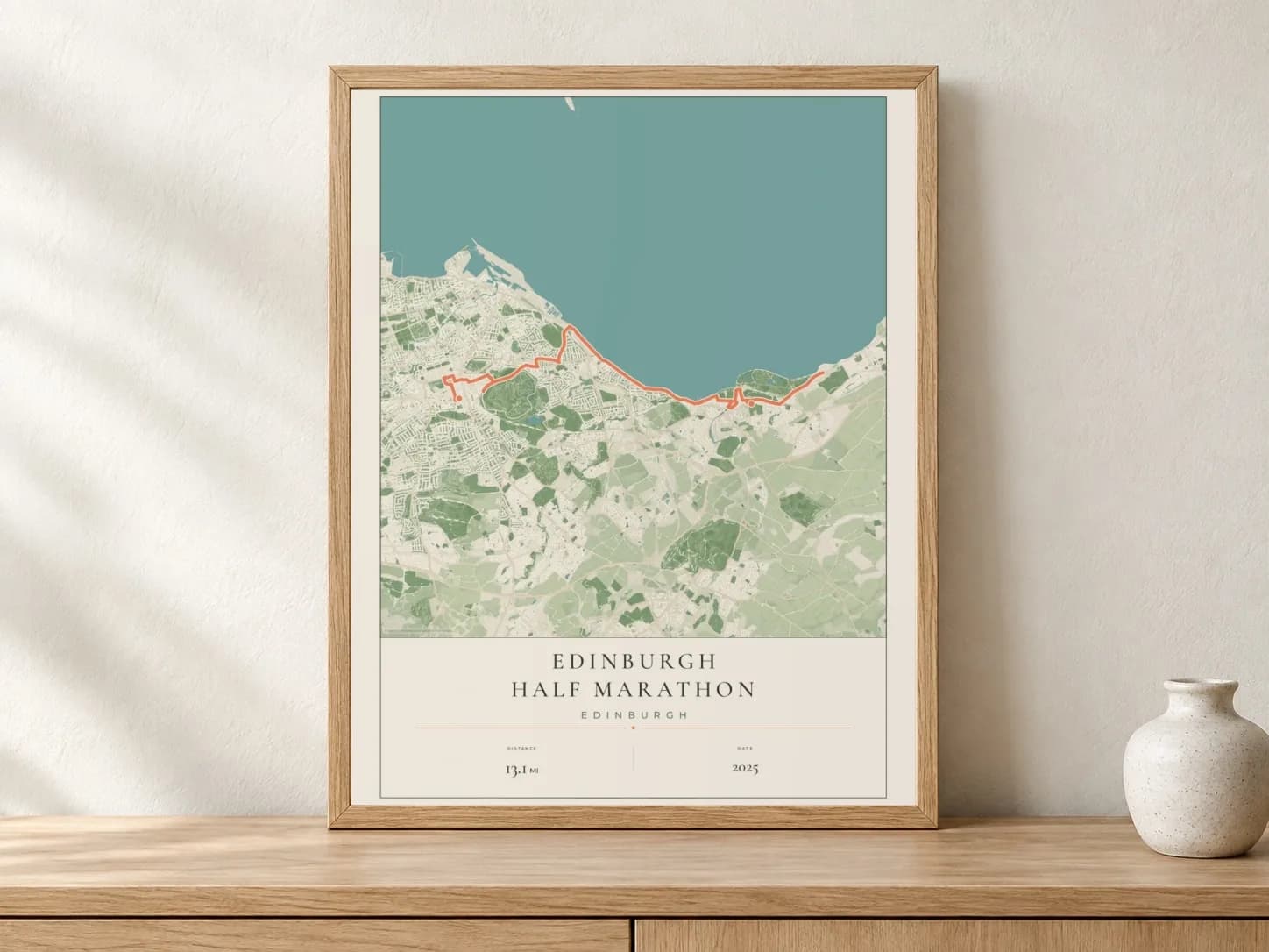 Edinburgh Half Marathon 2025 Parkland route print in a light oak frame on a console