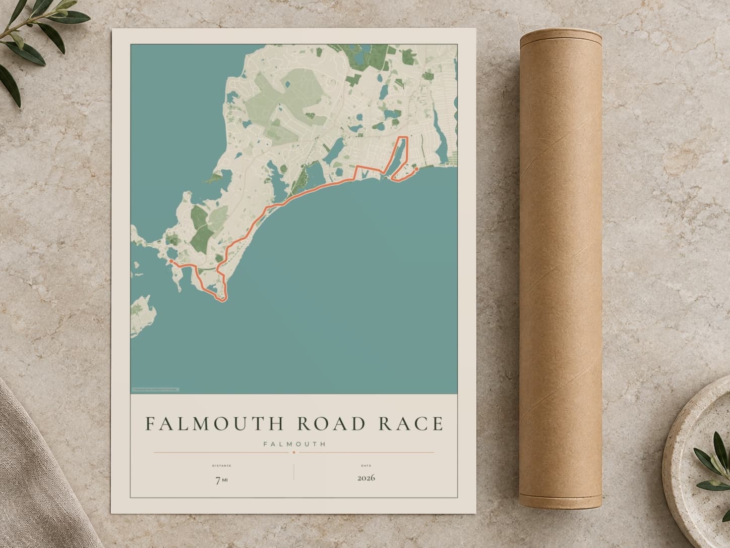 Cardboard postal tube beside a flat Falmouth Road Race route print