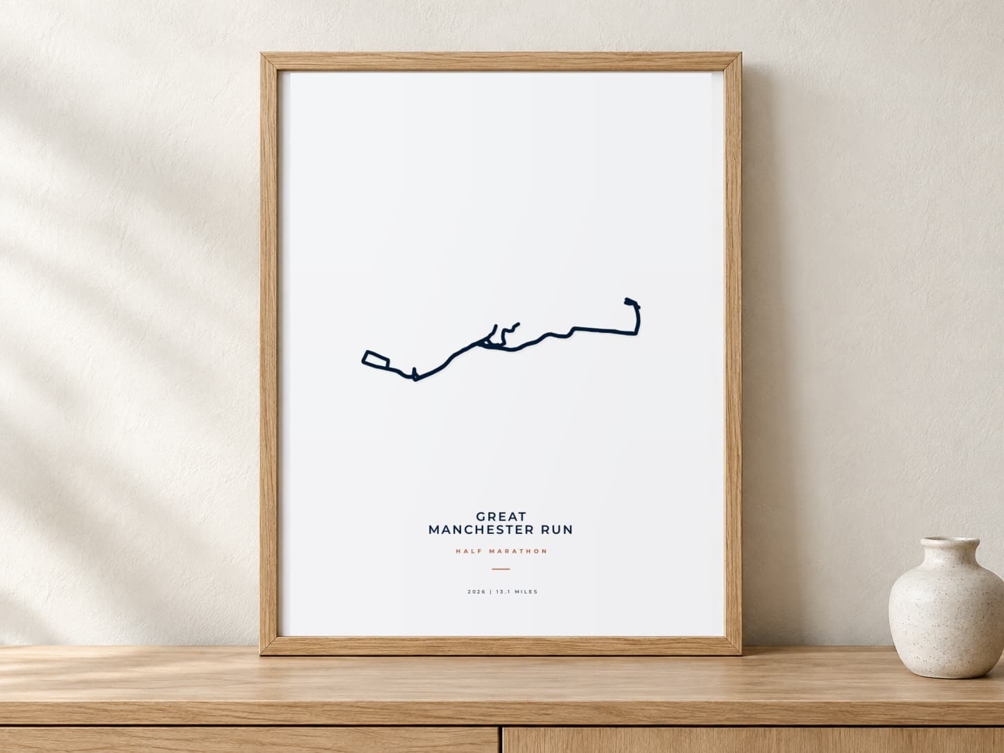 Great Manchester Run Half Marathon 2026 Minimal route print in a warm framed display scene