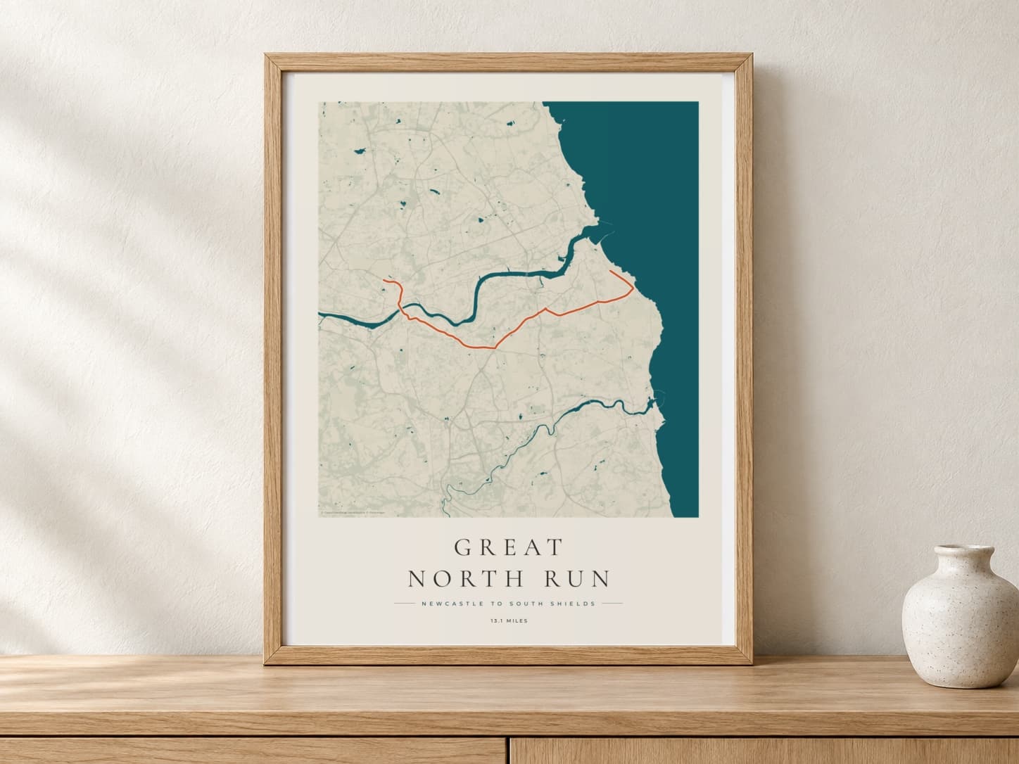 Great North Run 2026 Coastal Atlas route print in a warm framed display scene