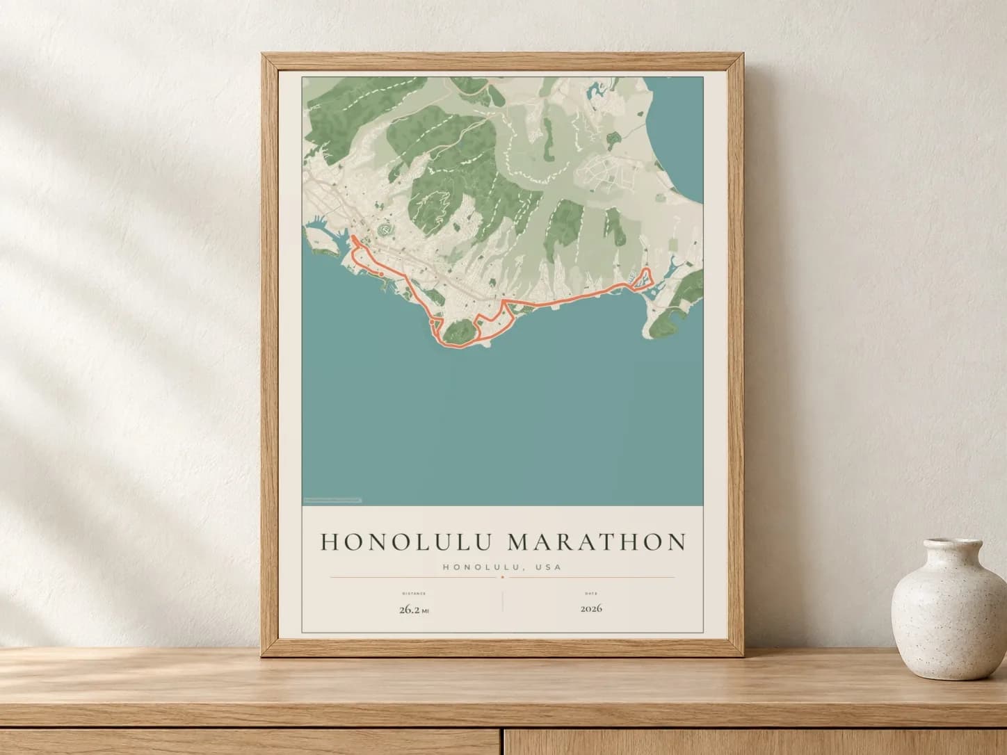 Honolulu Marathon 2026 Parkland route print in a light oak frame on a console