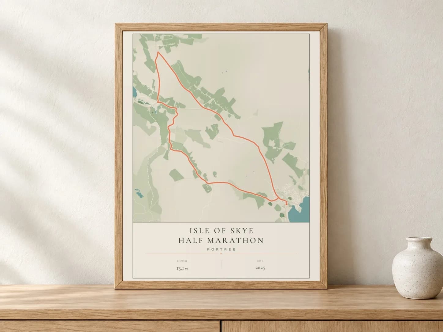Isle of Skye Half Marathon 2025 Parkland route print in a light oak frame on a console