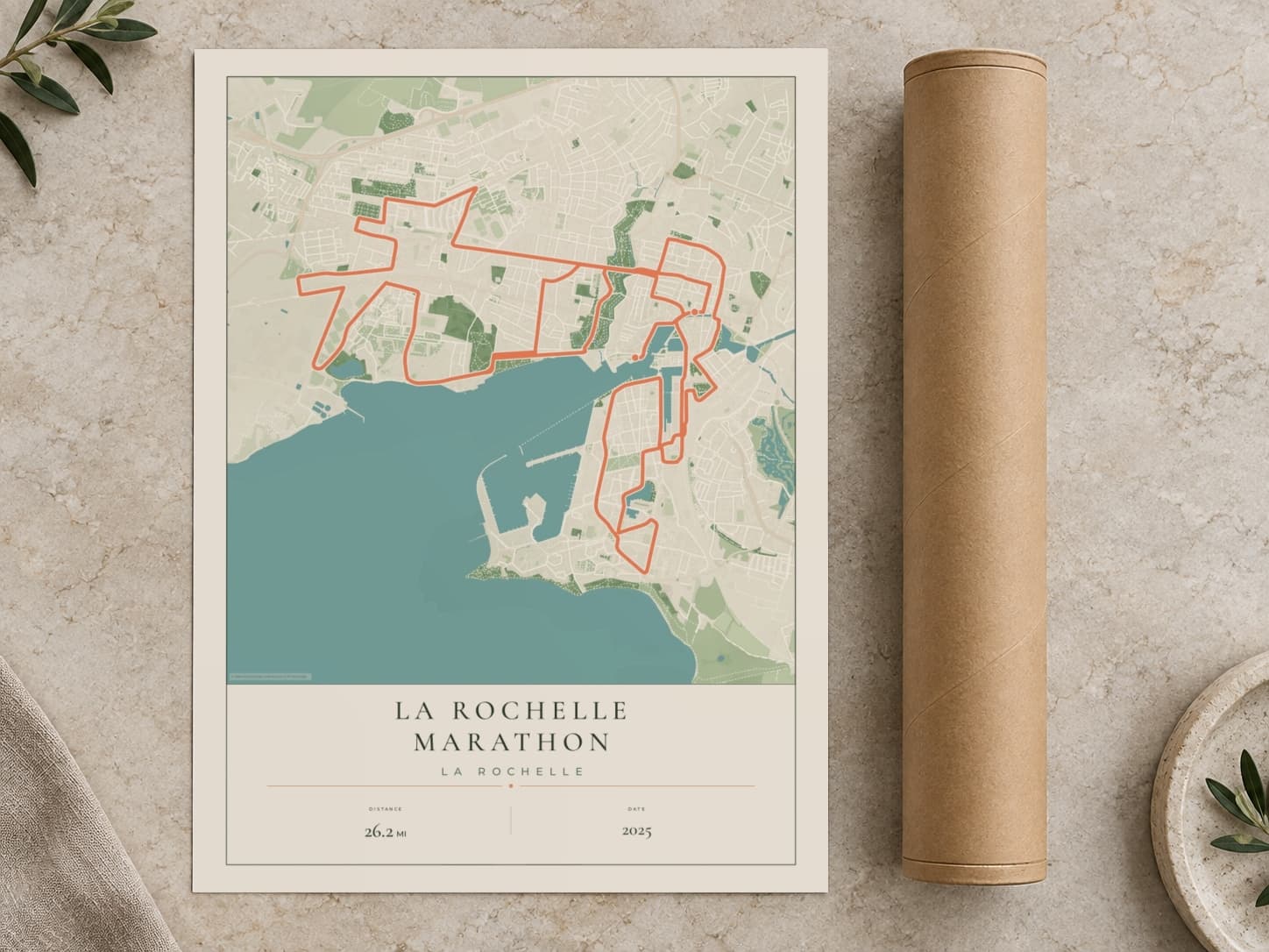 Cardboard postal tube beside a flat La Rochelle Marathon route print