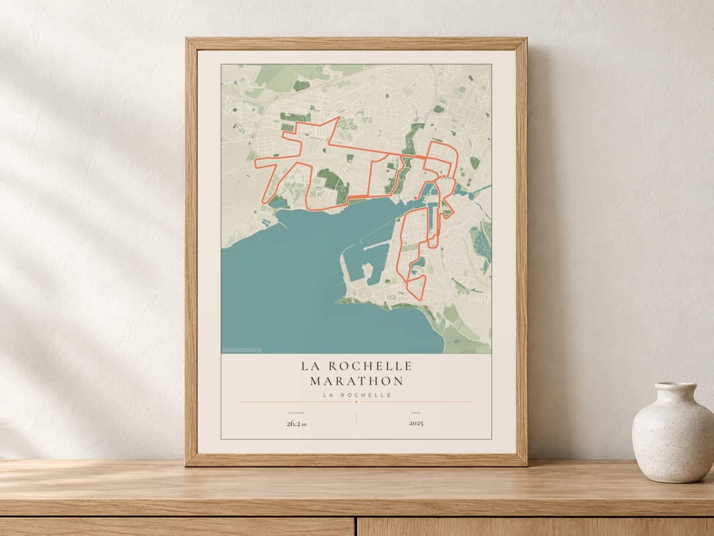 La Rochelle Marathon 2025 Parkland route print in a light oak frame on a console