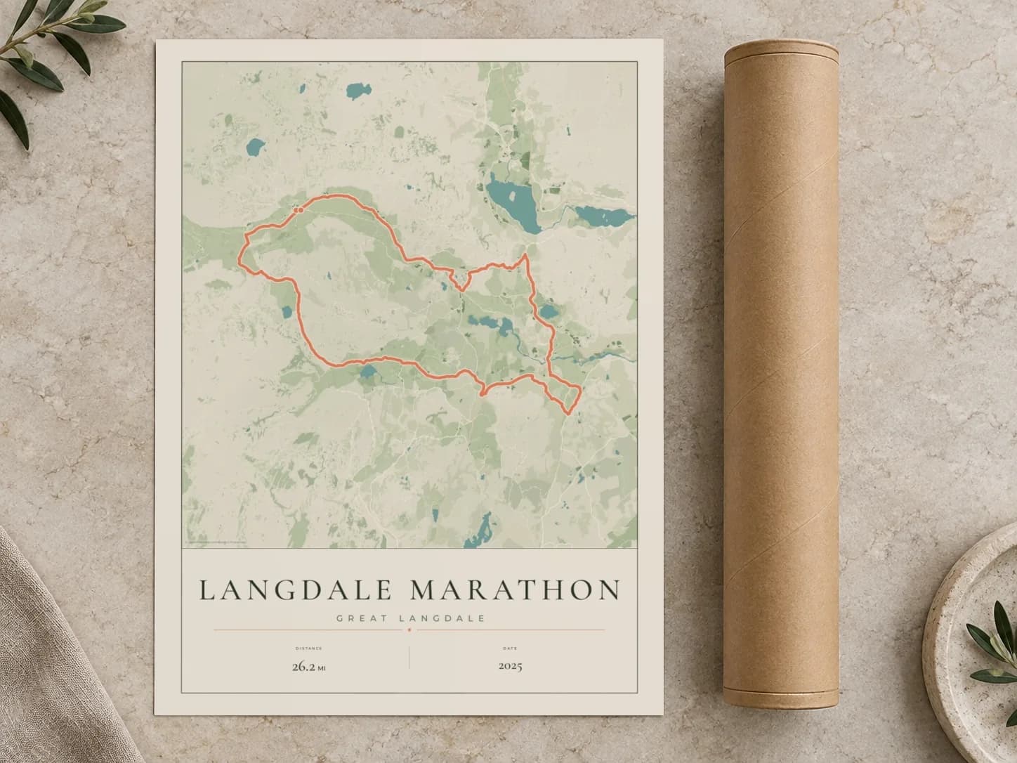 Cardboard postal tube beside a flat Langdale Marathon route print
