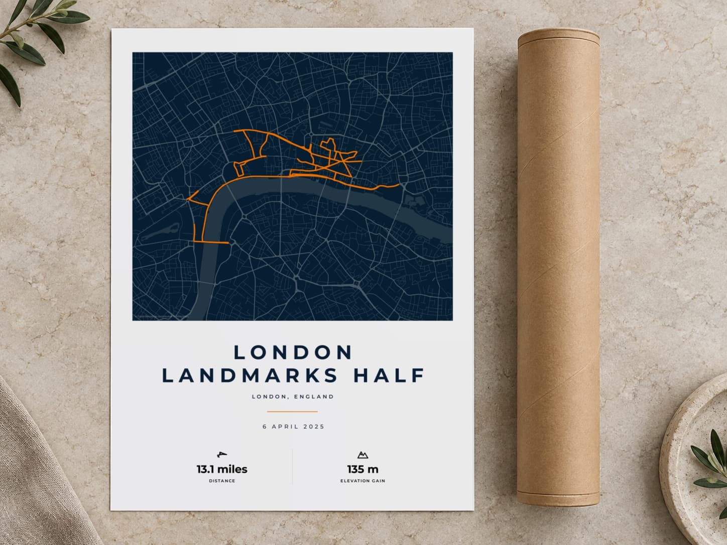 Cardboard postal tube beside a flat London Landmarks Half Marathon route print