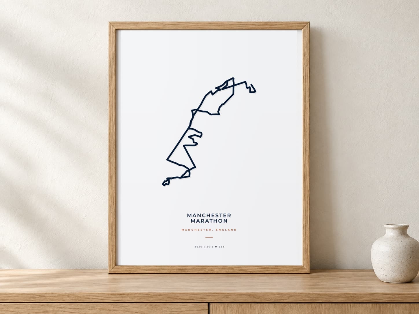 Manchester Marathon 2026 Minimal route print in a warm framed display scene