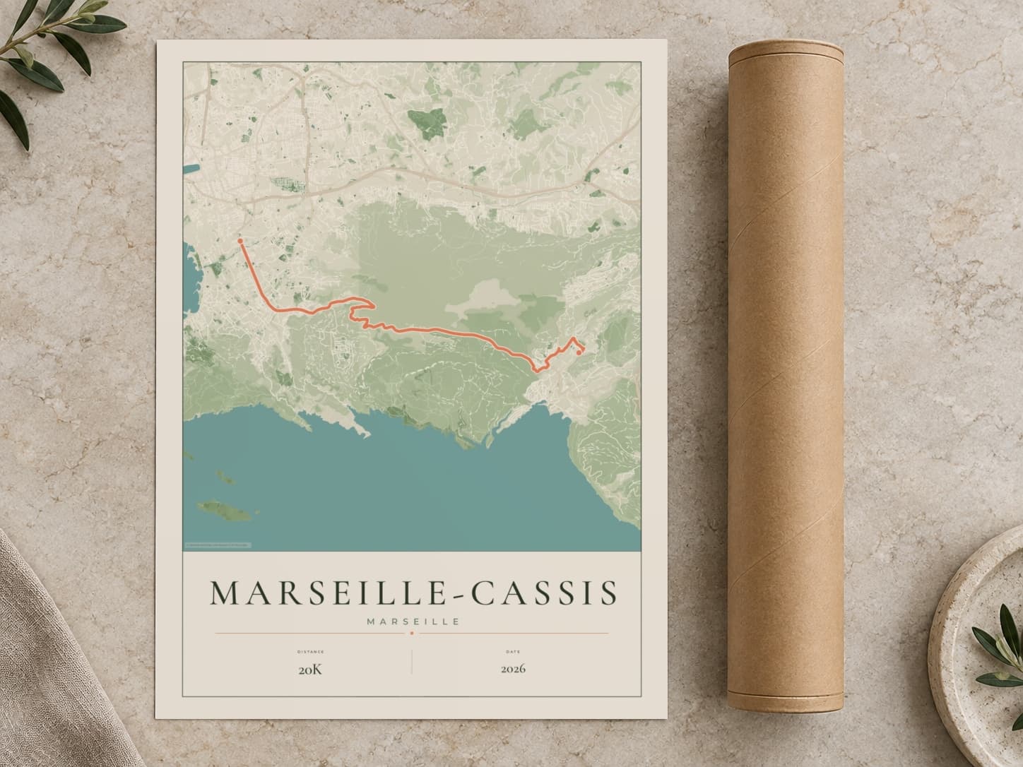 Cardboard postal tube beside a flat Marseille-Cassis route print