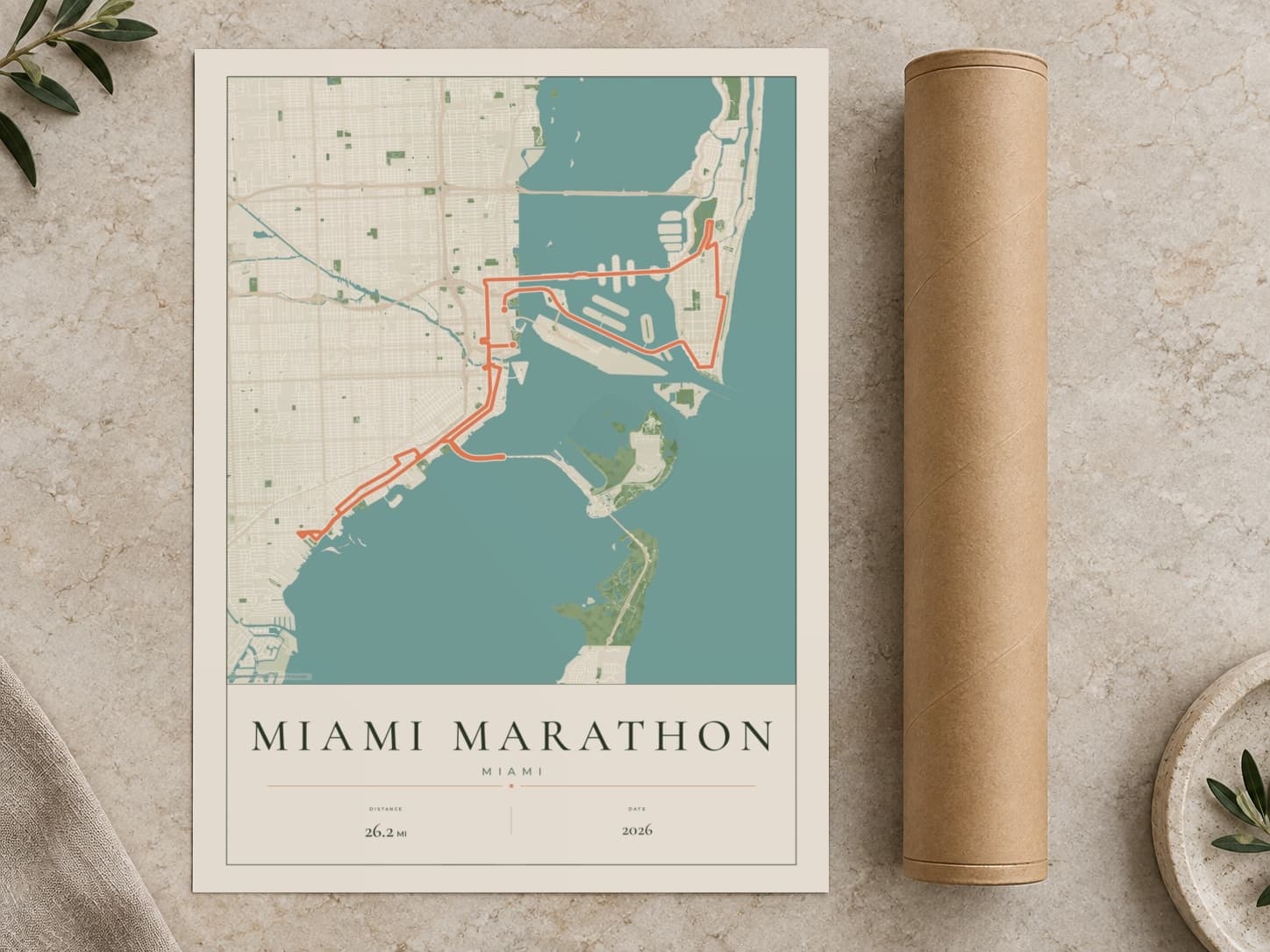 Cardboard postal tube beside a flat Miami Marathon route print