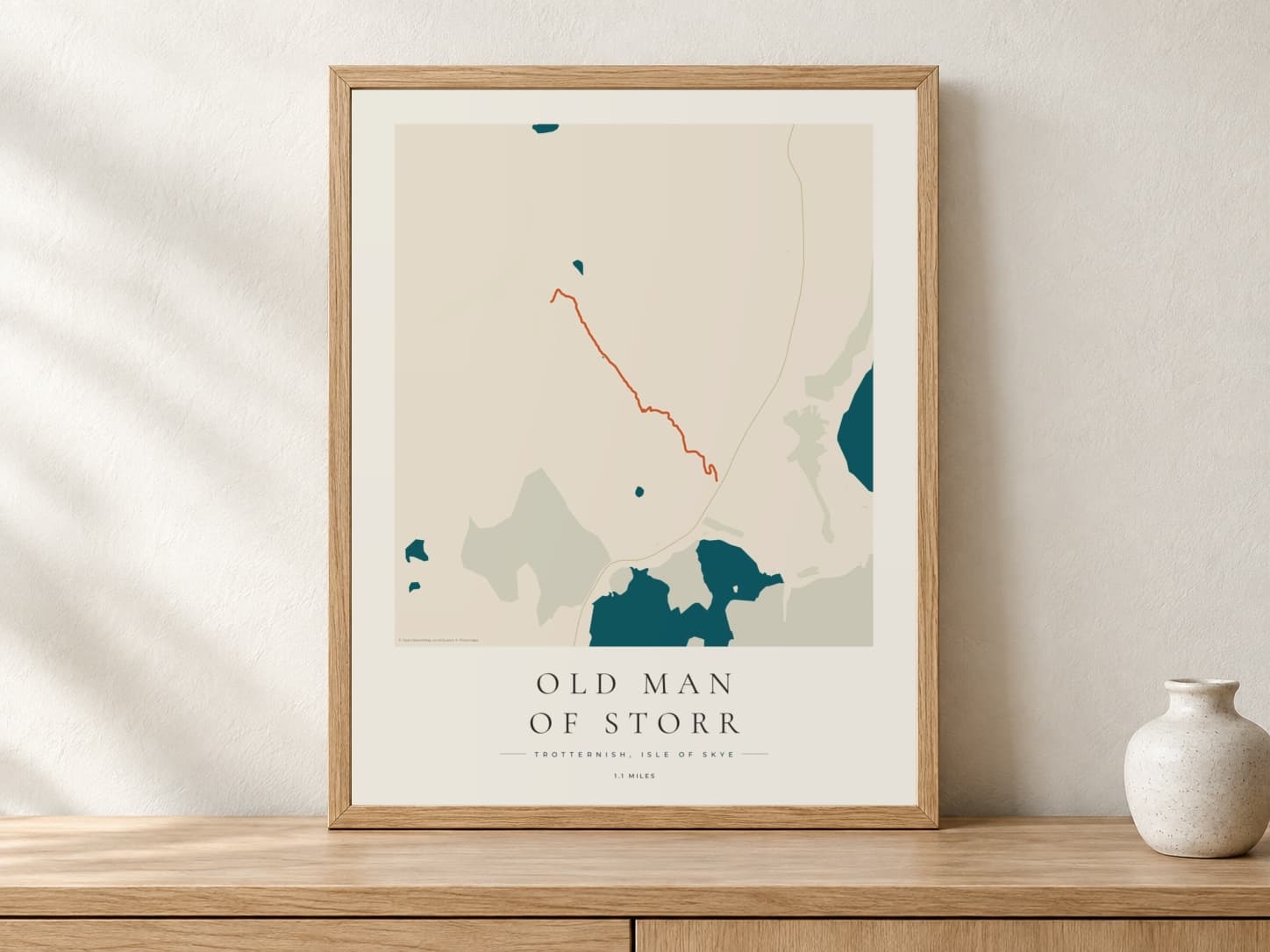 Old Man of Storr Coastal Atlas route print in a light oak frame on a console