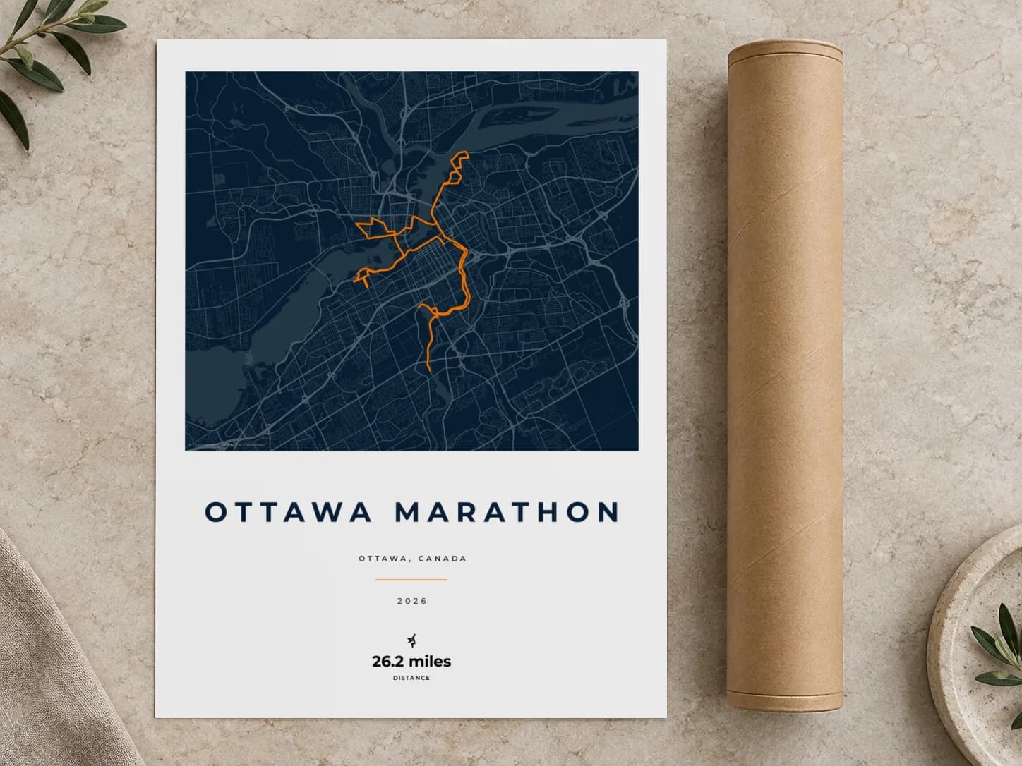 Cardboard postal tube beside a flat Ottawa Marathon route print