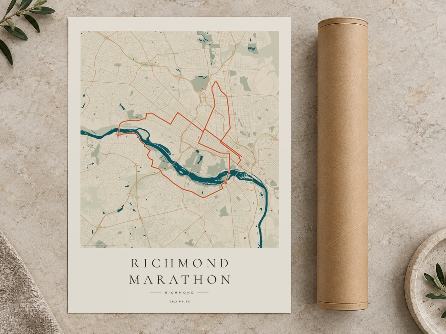 Cardboard postal tube beside a flat Richmond Marathon route print