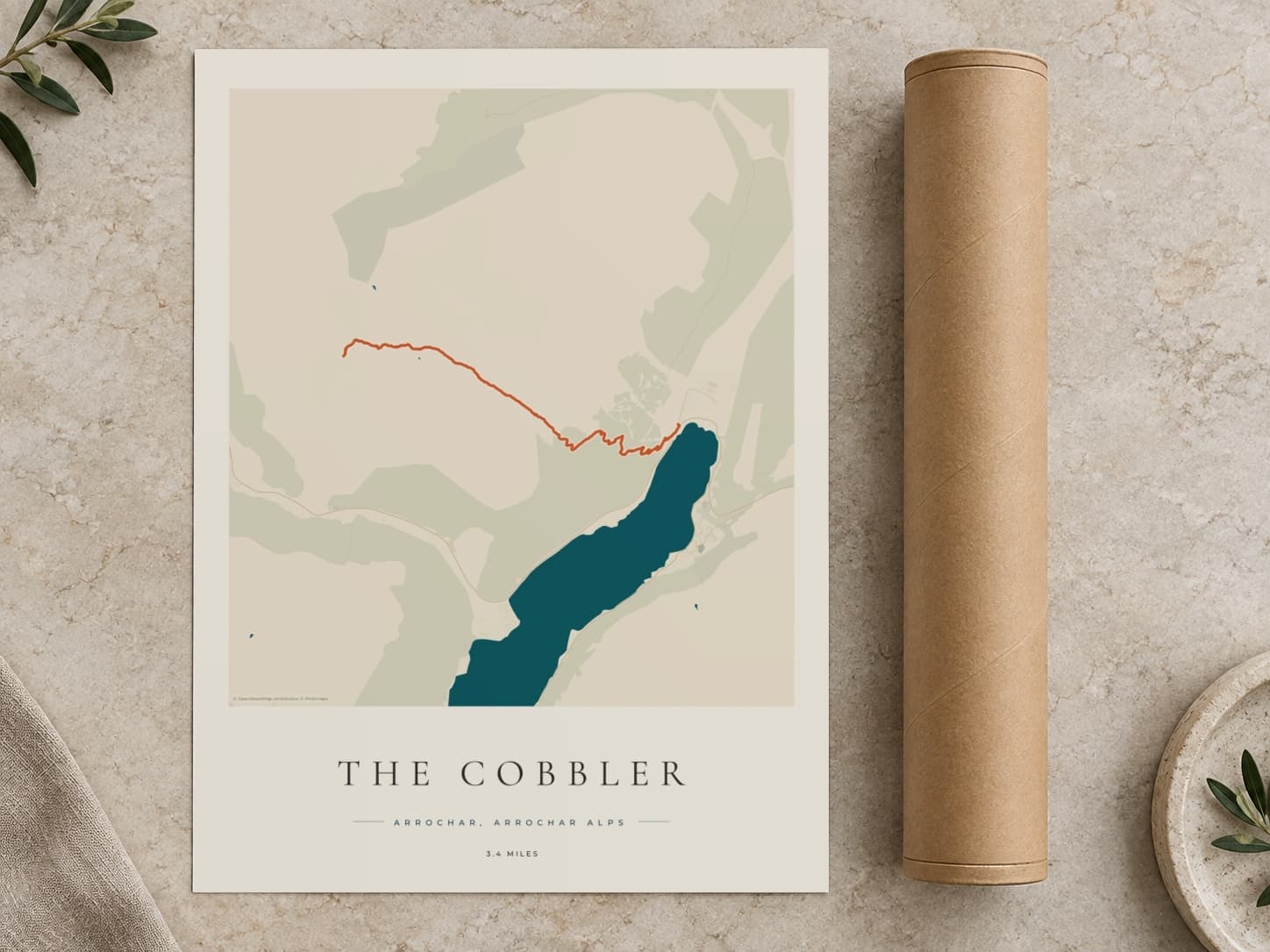 Cardboard postal tube beside a flat The Cobbler route print