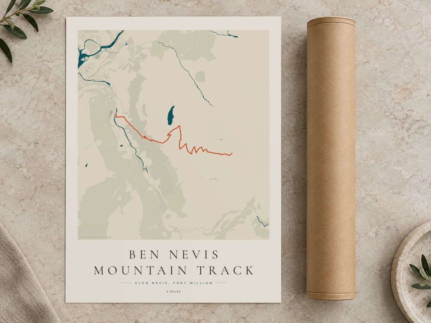 Cardboard postal tube beside a flat Ben Nevis route print