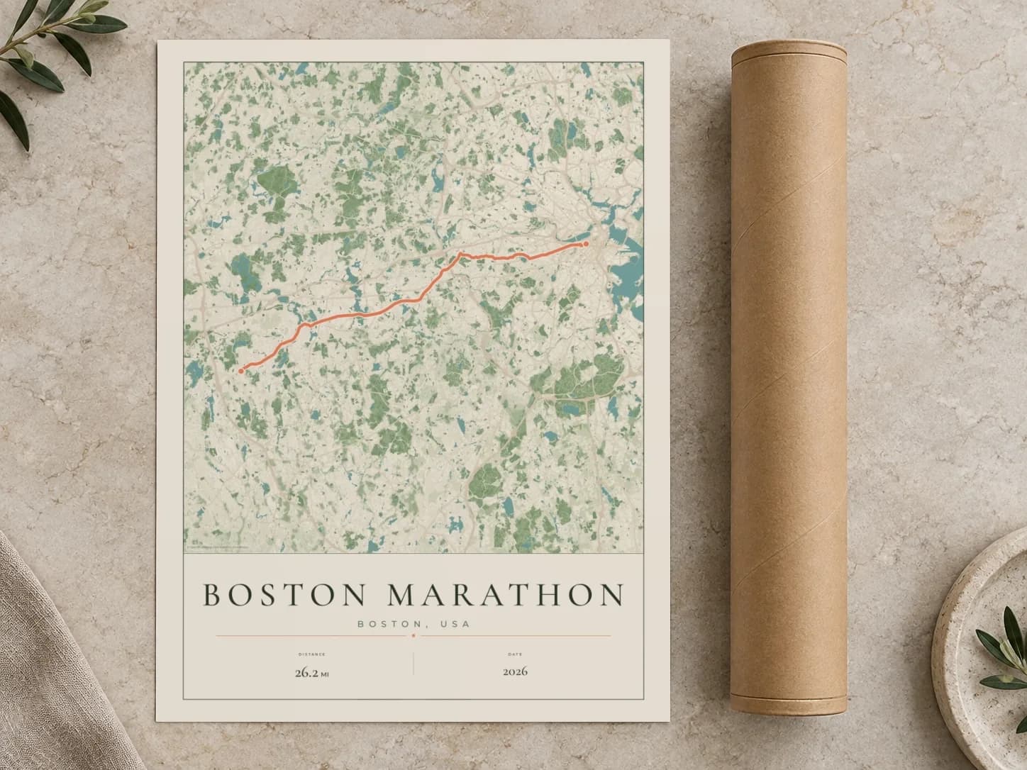 Cardboard postal tube beside a flat Boston Marathon route print