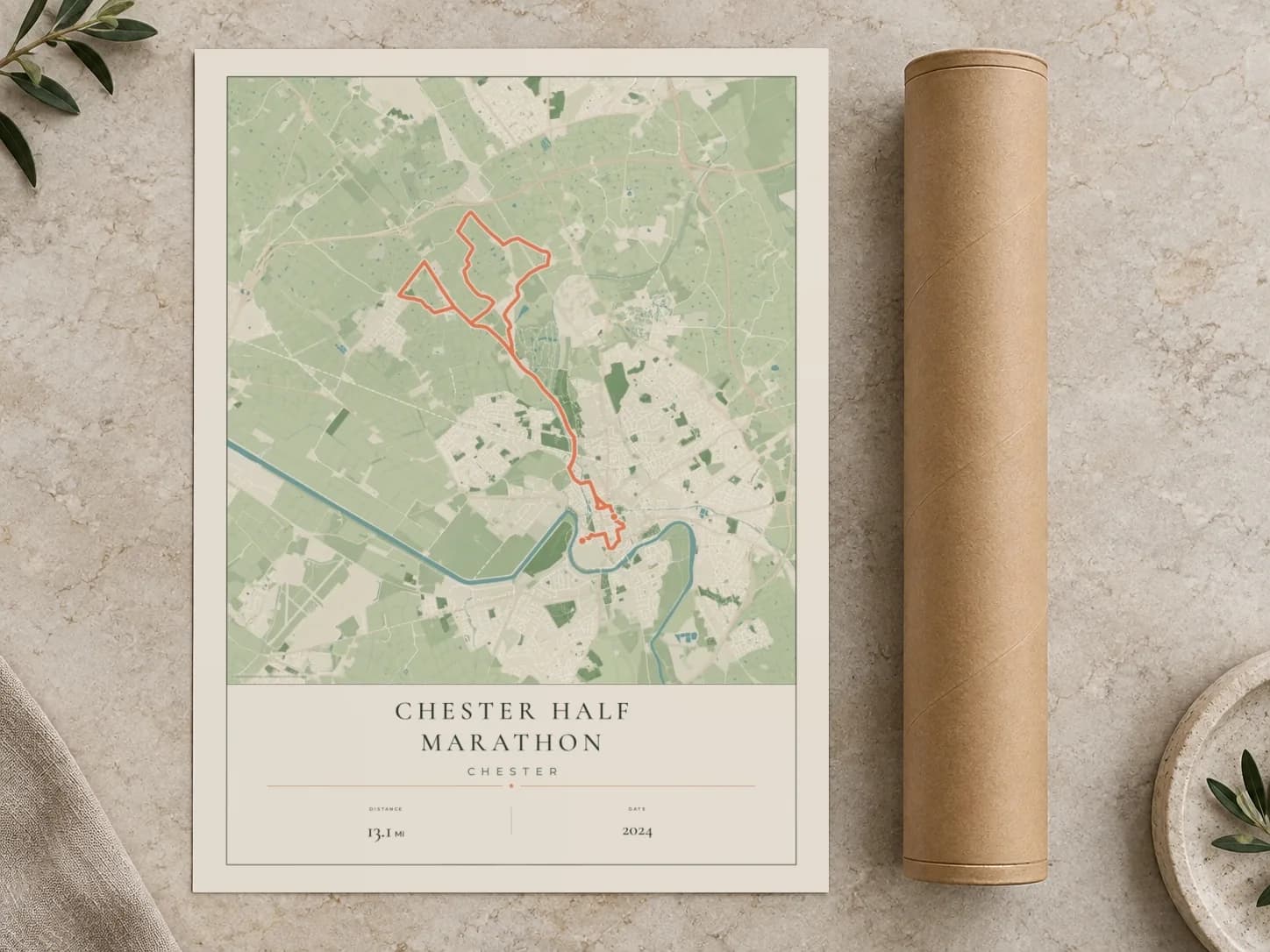 Cardboard postal tube beside a flat Chester Half Marathon route print
