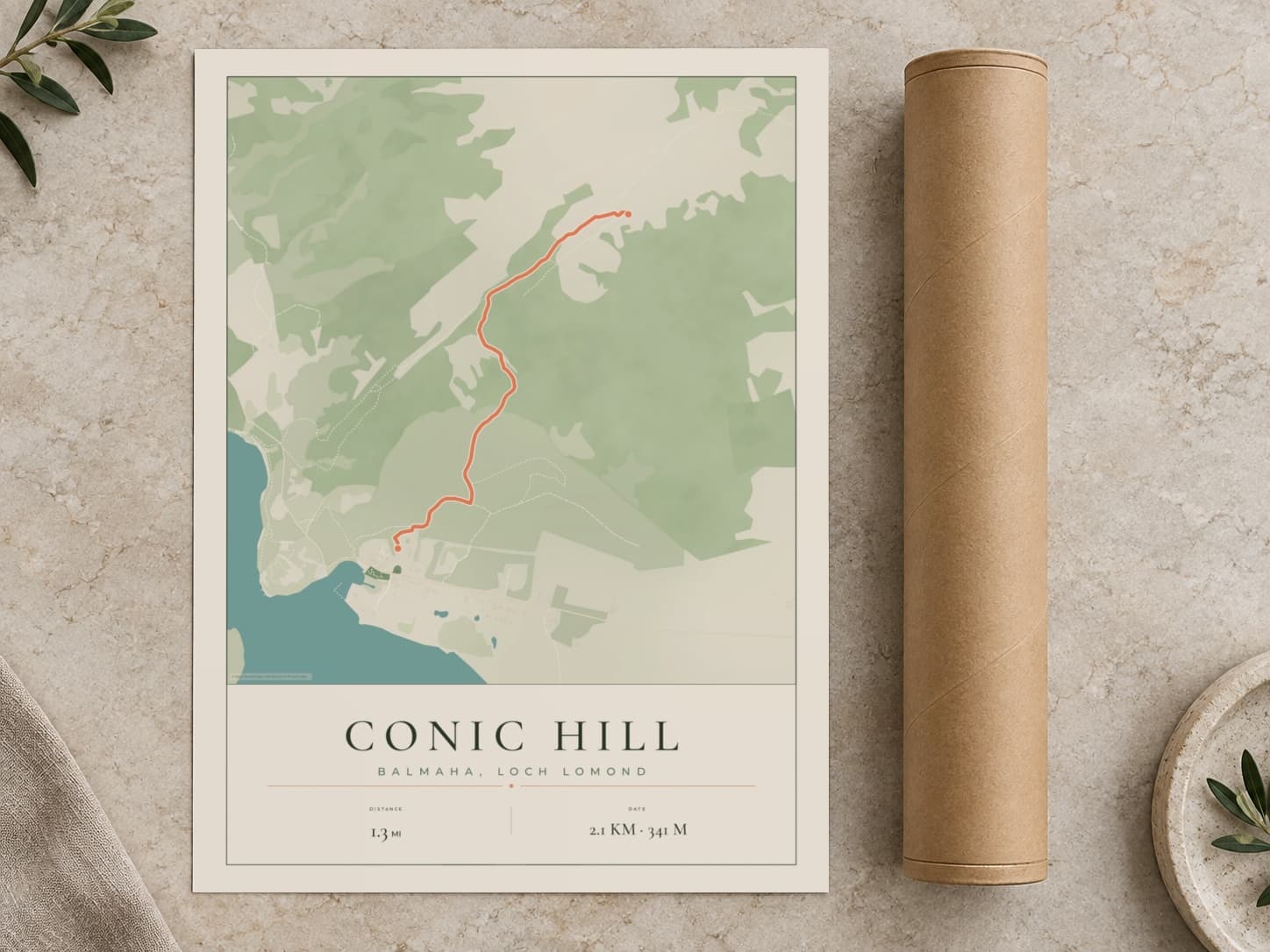 Cardboard postal tube beside a flat Conic Hill route print