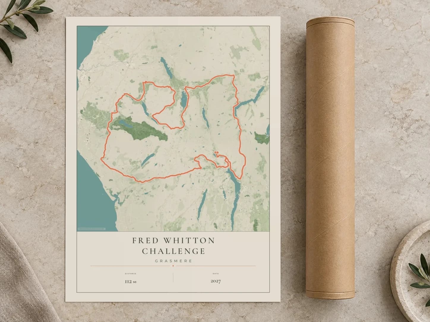 Cardboard postal tube beside a flat Fred Whitton Challenge route print