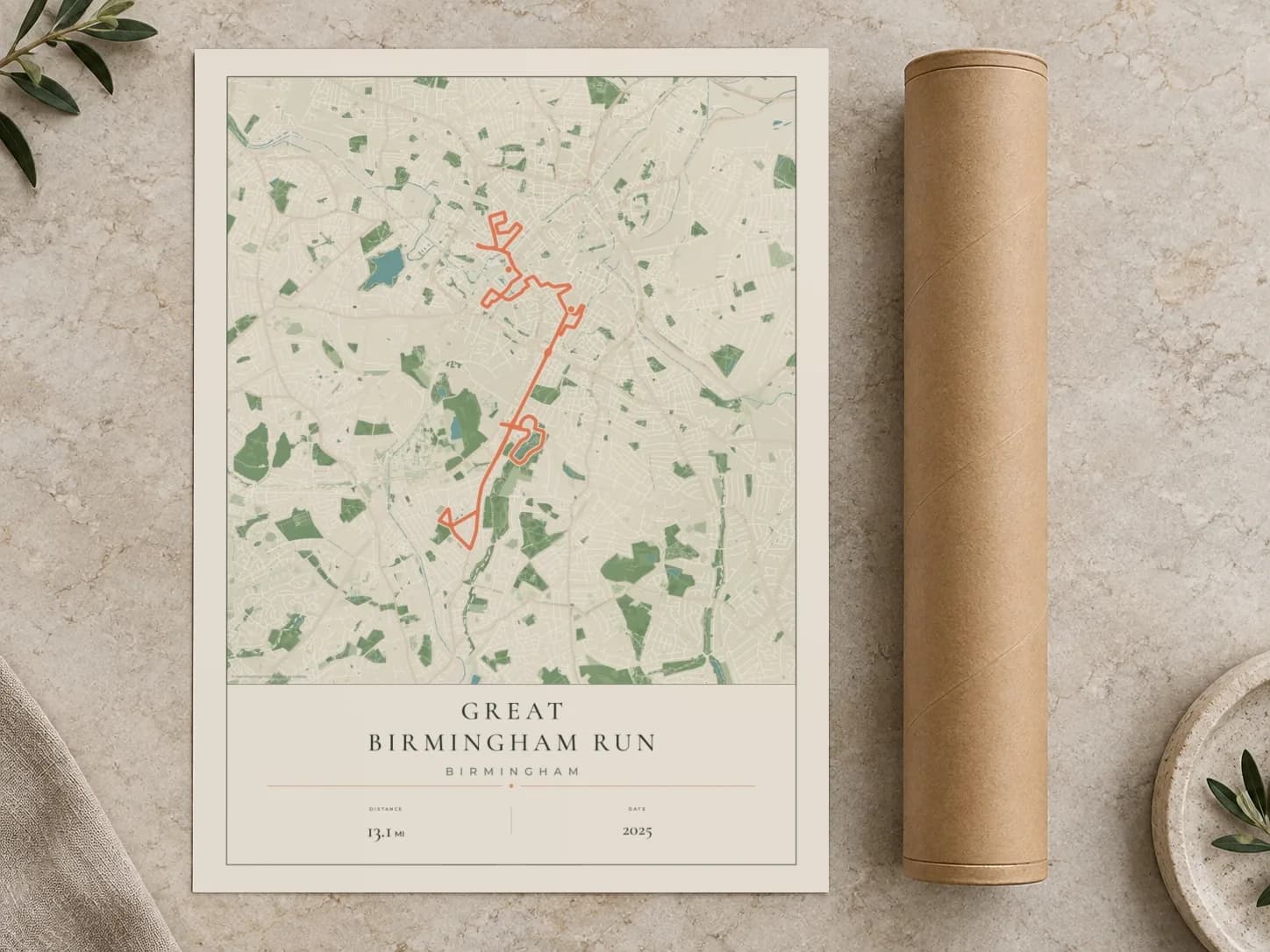 Cardboard postal tube beside a flat Great Birmingham Run route print