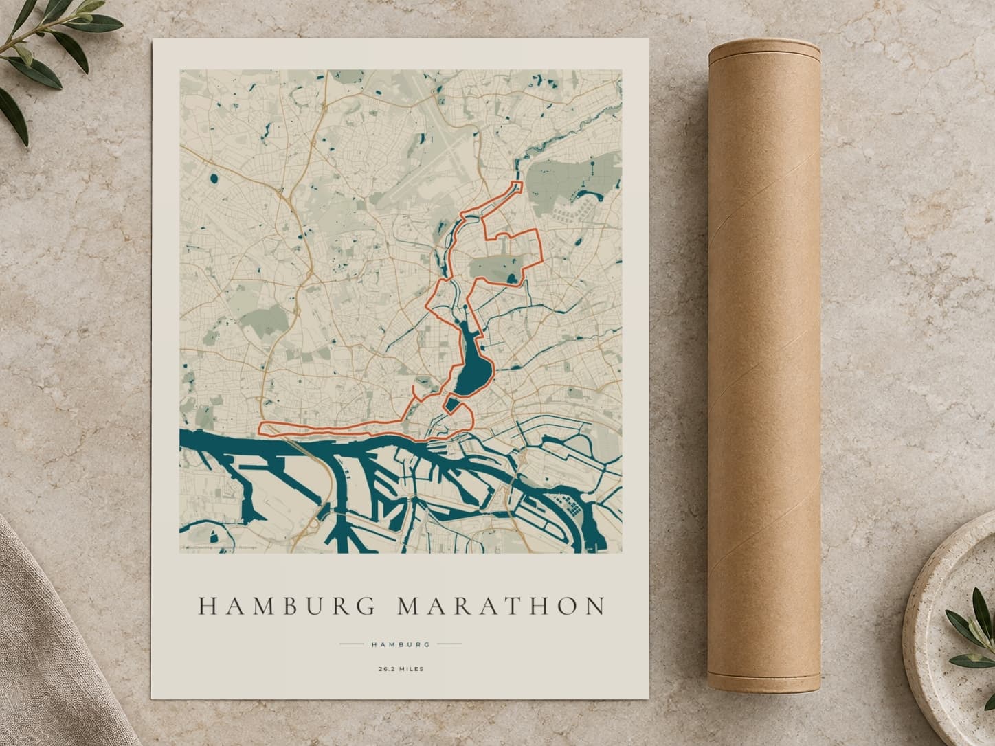 Cardboard postal tube beside a flat Hamburg Marathon route print