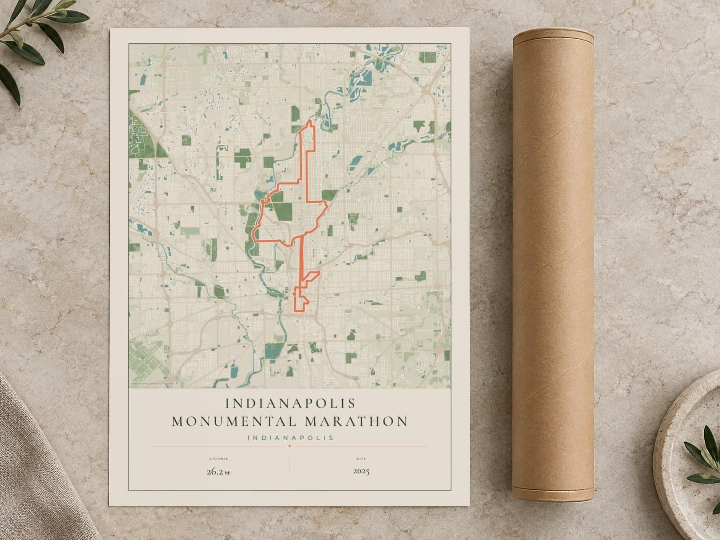 Cardboard postal tube beside a flat Indianapolis Monumental Marathon route print