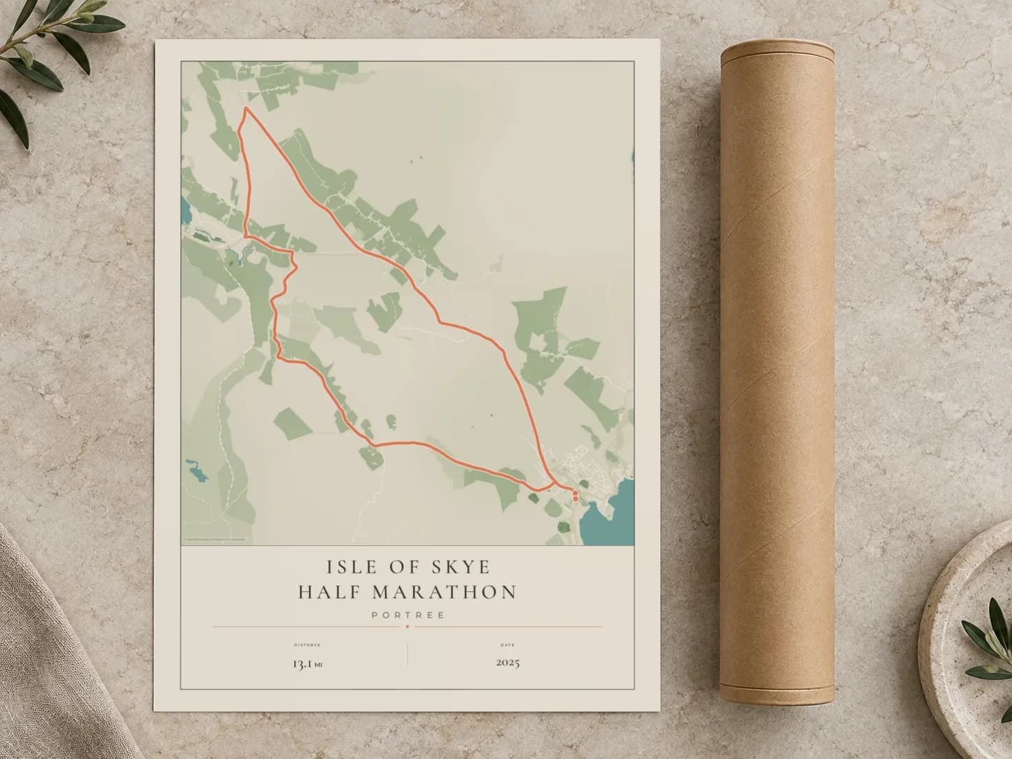 Cardboard postal tube beside a flat Isle of Skye Half Marathon route print