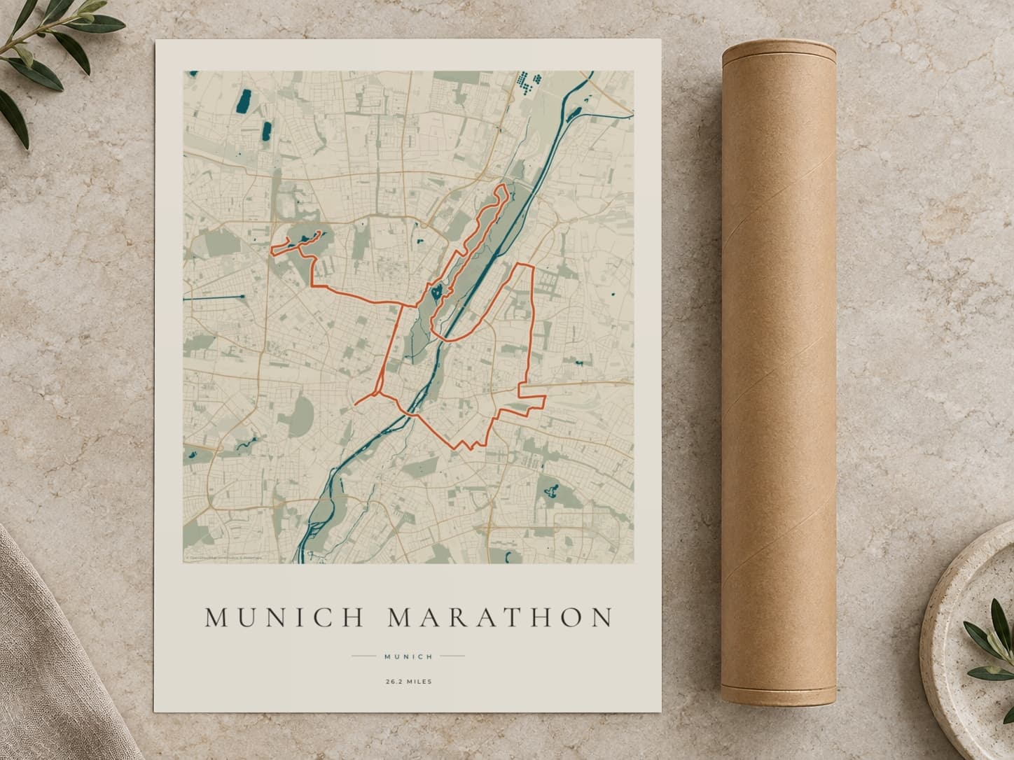 Cardboard postal tube beside a flat Munich Marathon route print