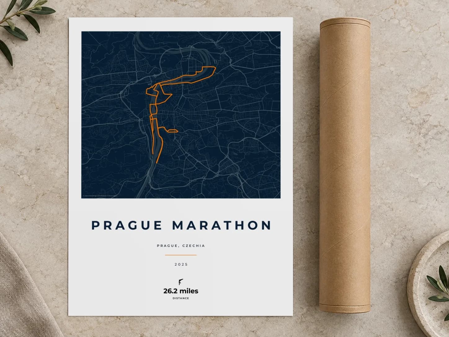 Cardboard postal tube beside a flat Prague Marathon route print