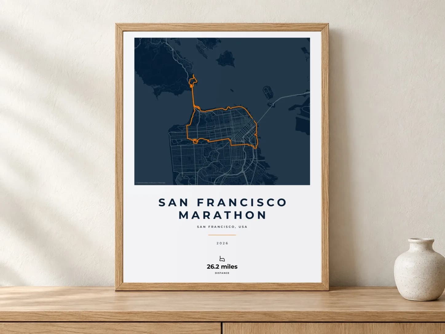 San Francisco Marathon 2026 Race Blueprint route print in a light oak frame on a console