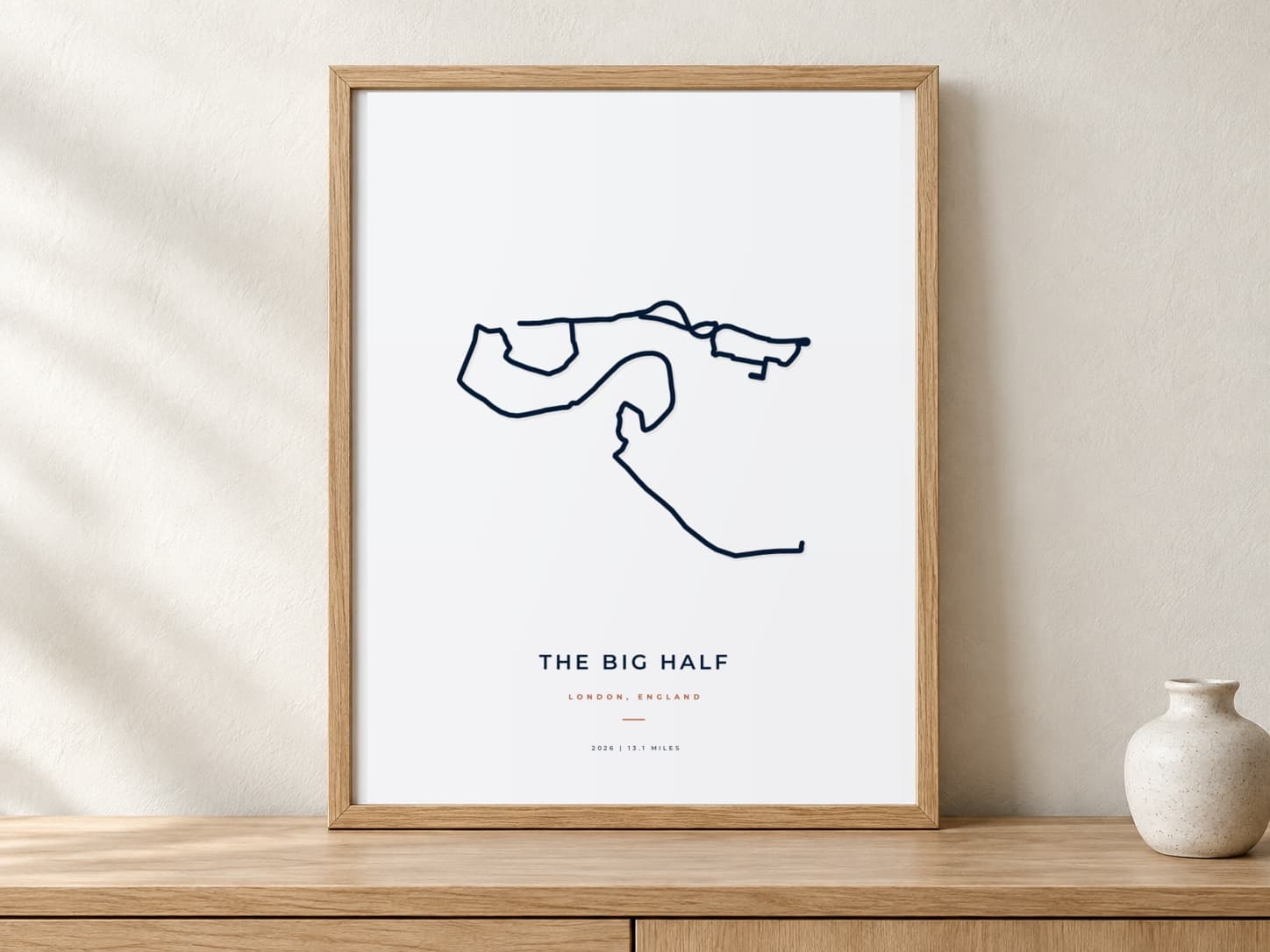 The Big Half 2026 Minimal route print in a warm framed display scene