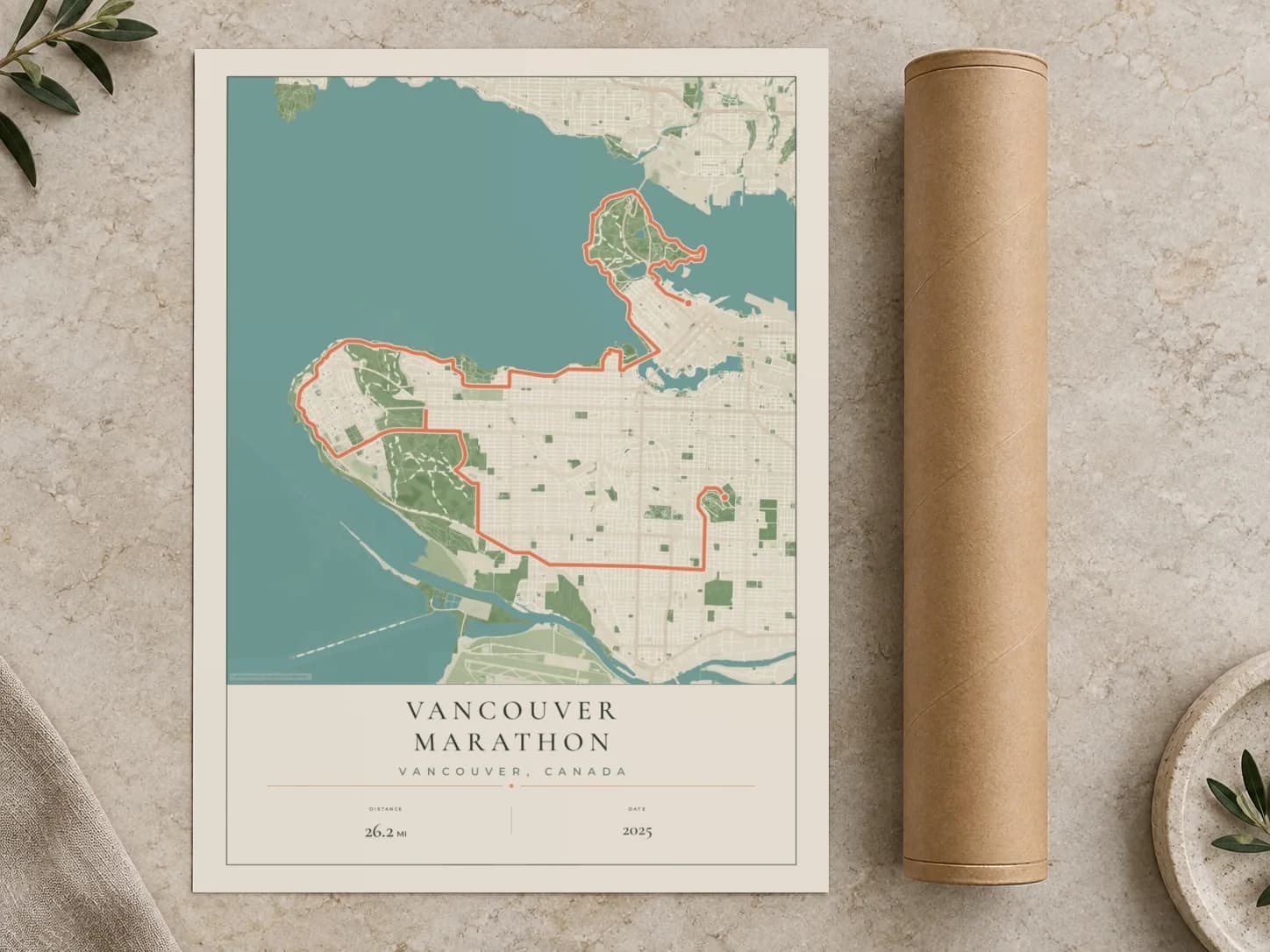 Cardboard postal tube beside a flat Vancouver Marathon route print