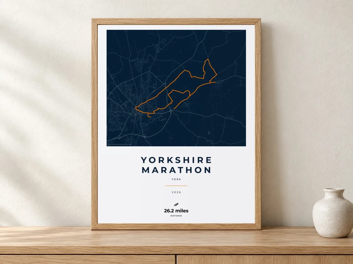 Yorkshire Marathon Race Blueprint route print in a light oak frame on a console