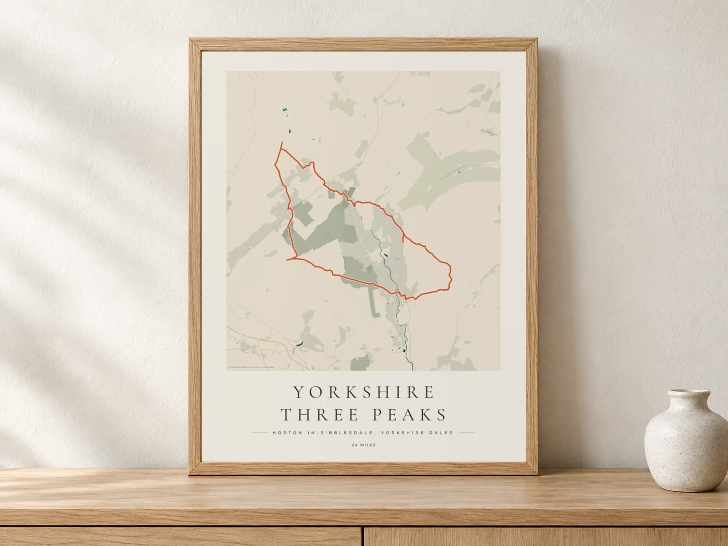 Yorkshire Three Peaks Coastal Atlas route print in a light oak frame on a console