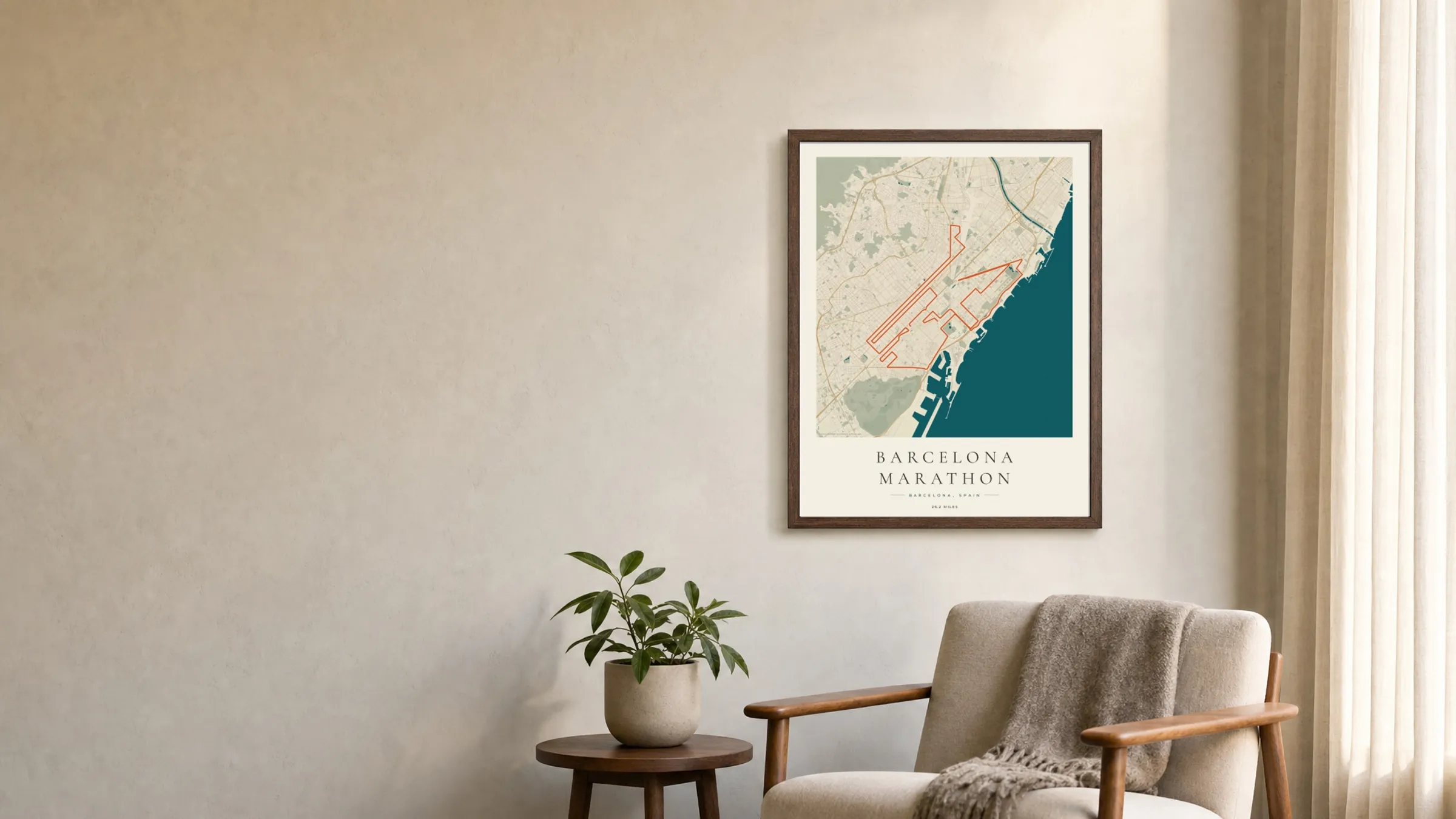 Barcelona Marathon 2026 Coastal Atlas route print in a dark walnut frame on a living-room wall