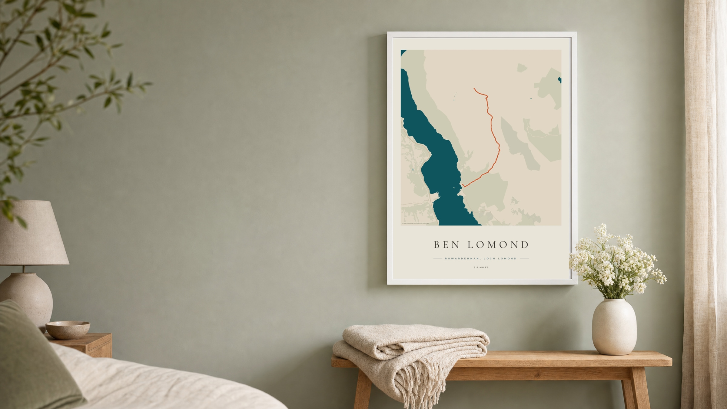Ben Lomond Coastal Atlas route print in a white frame on a sage bedroom wall