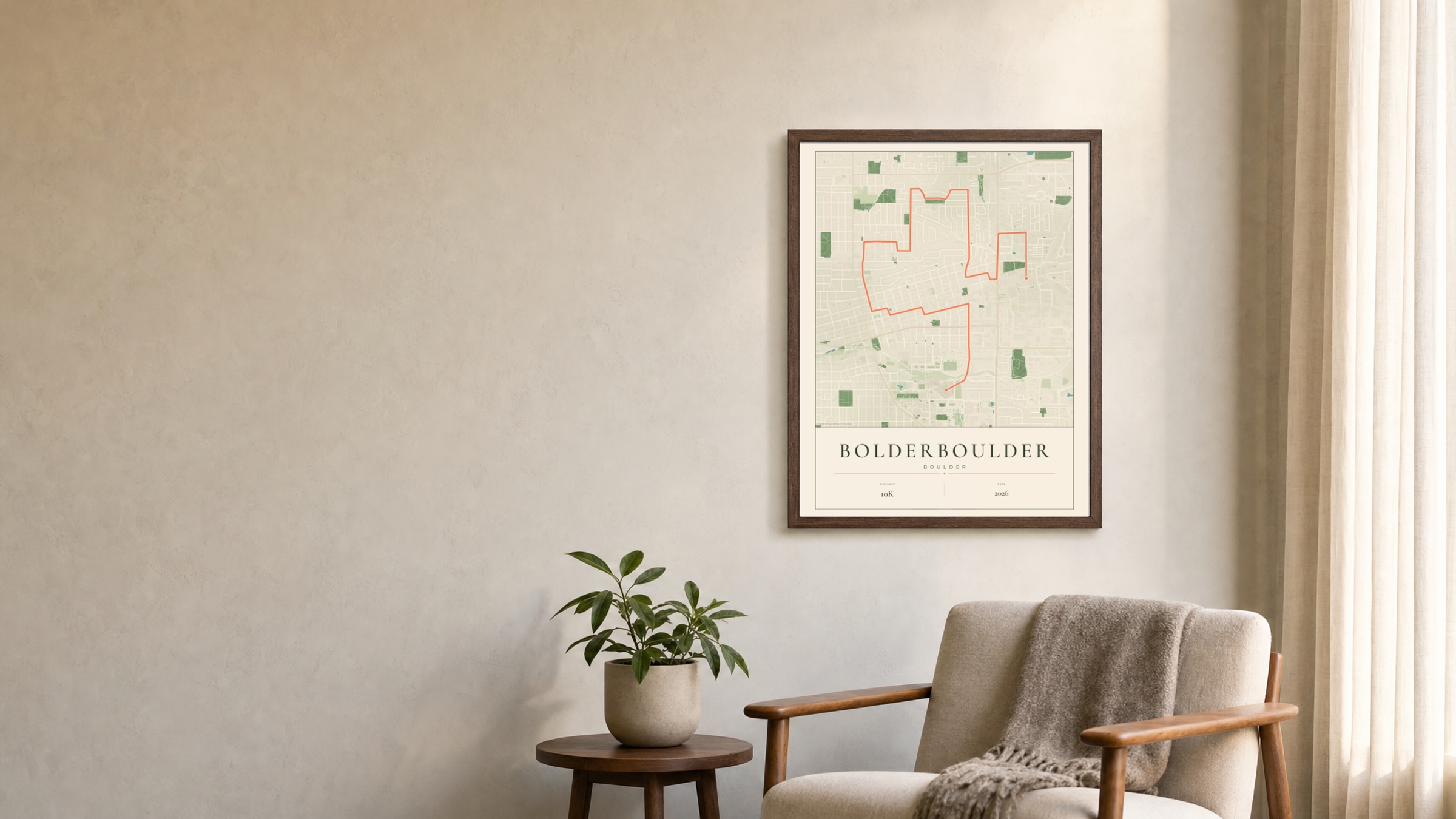 BOLDERBoulder 2026 Parkland route print in a dark walnut frame on a living-room wall
