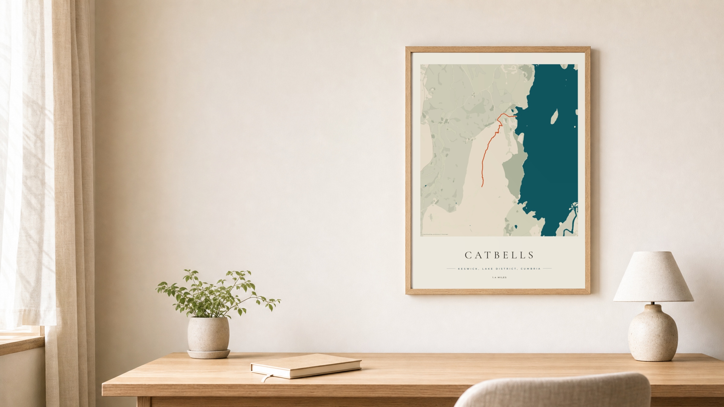 Catbells Coastal Atlas route print in an oak frame above a study desk