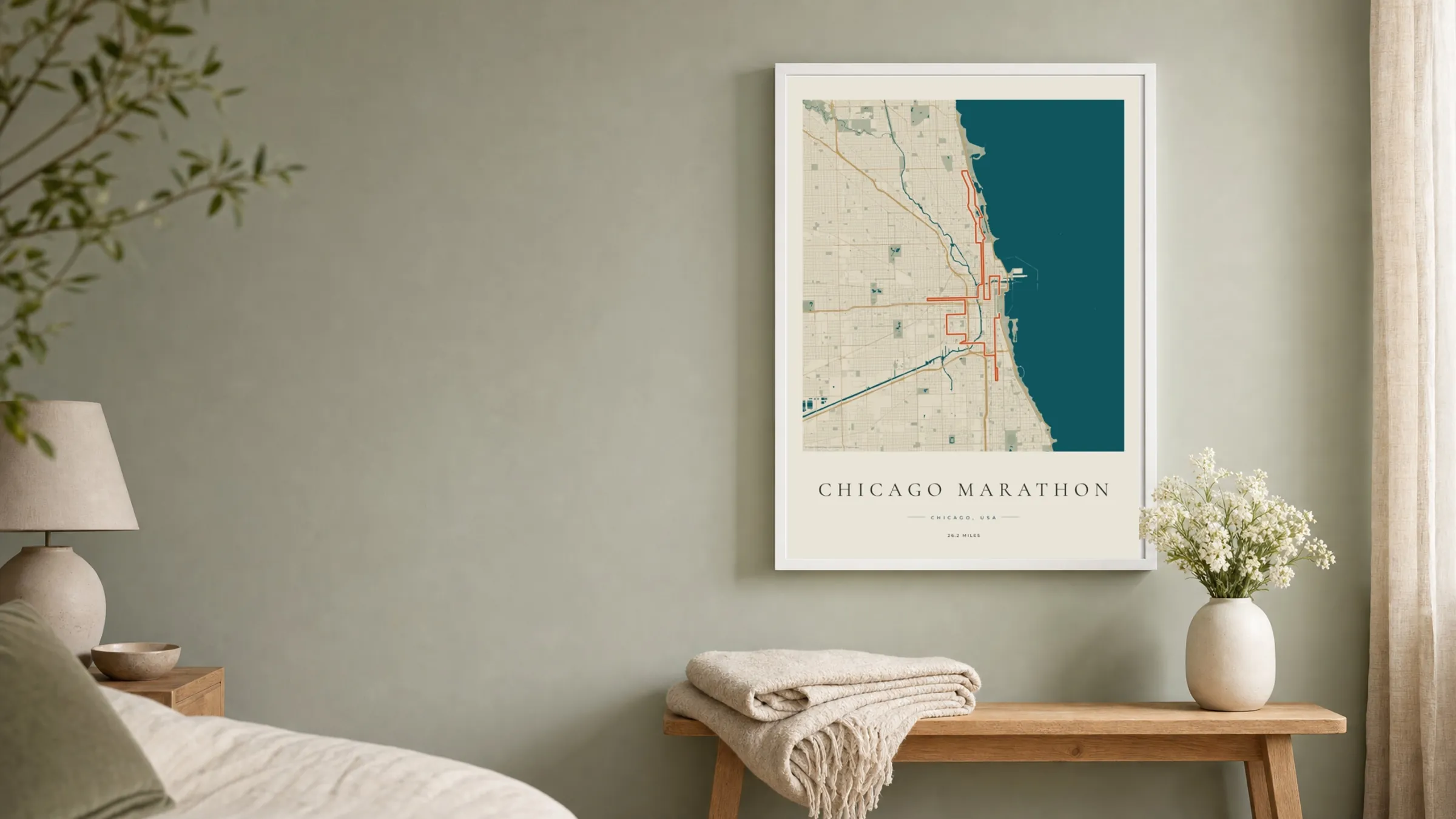 Chicago Marathon 2026 Coastal Atlas route print in a white frame on a sage bedroom wall