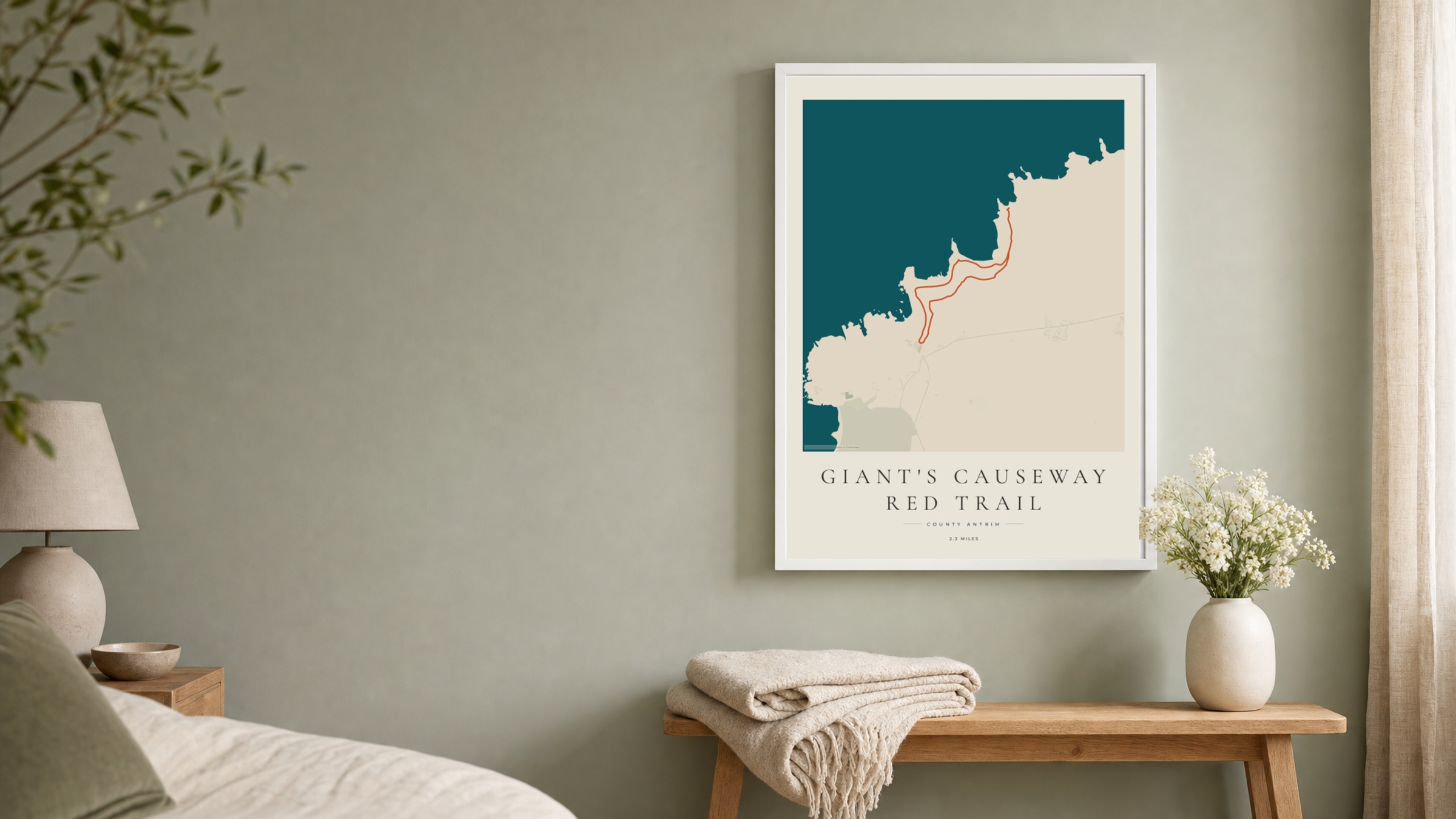 Giant's Causeway Coastal Atlas route print in a white frame on a sage bedroom wall