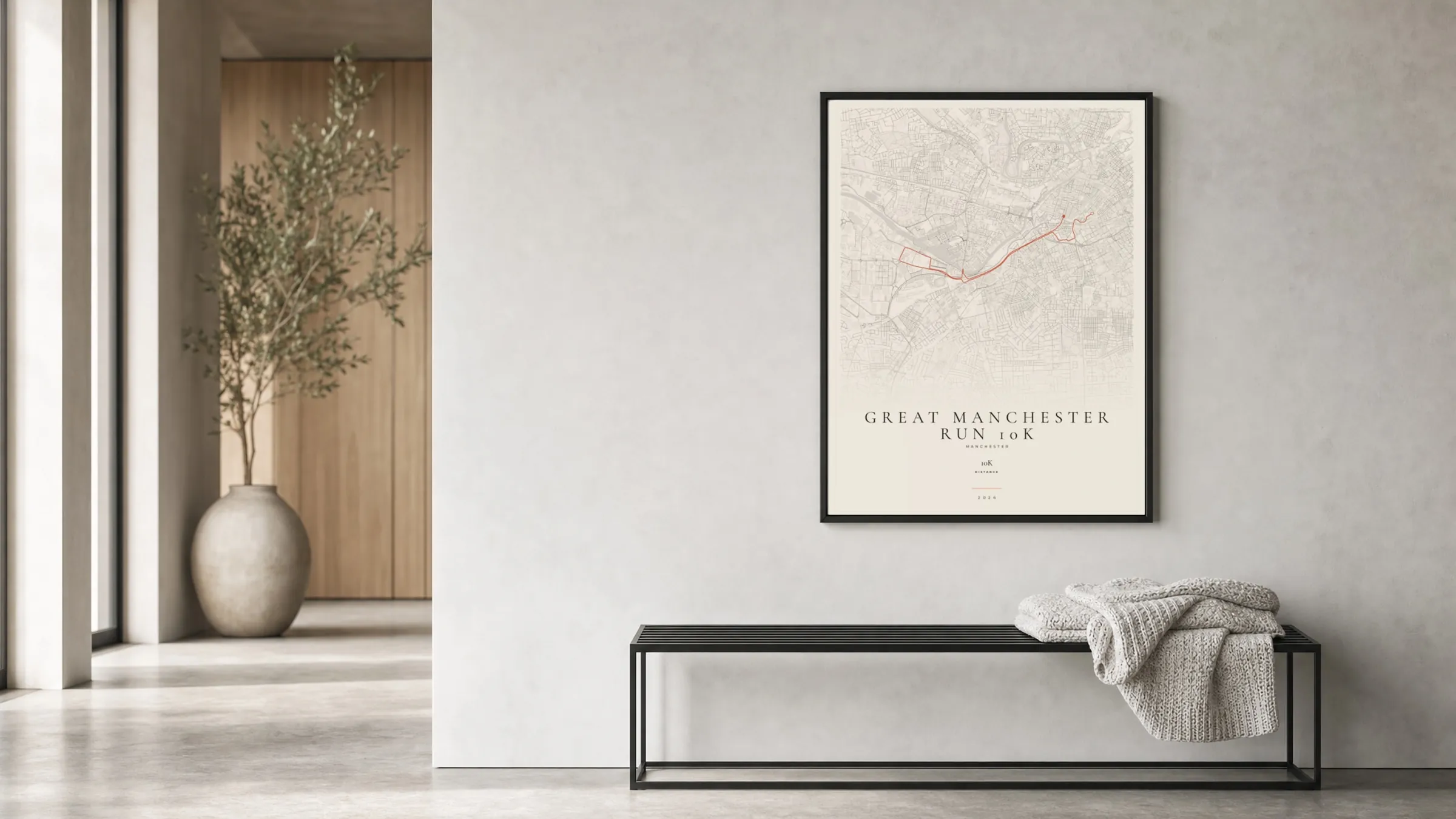 Great Manchester Run 10K 2026 Gallery Mono route print in a black frame in a bright hallway