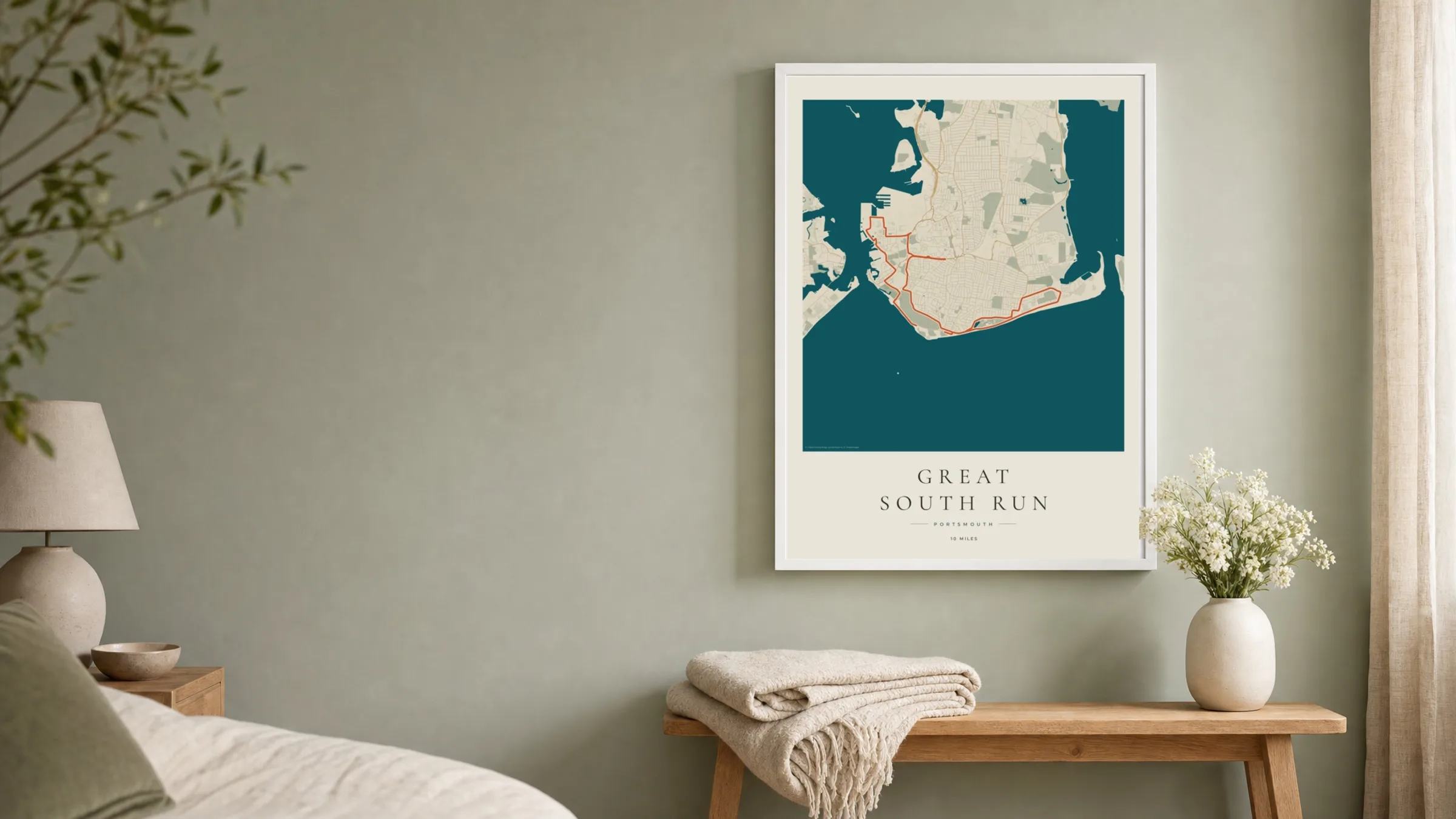 Great South Run Coastal Atlas route print in a white frame on a sage bedroom wall
