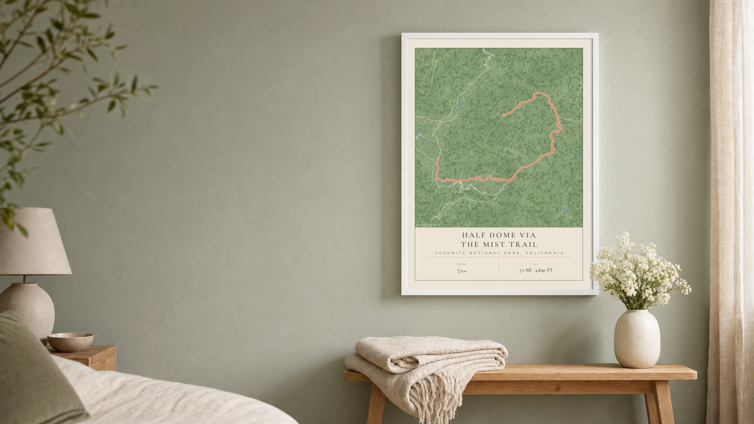 Half Dome Parkland route print in a white frame on a sage bedroom wall
